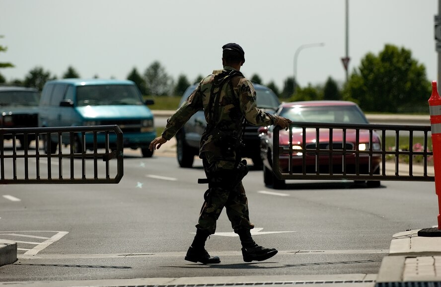 DOVER AIR FORCE BASE, Del. -- Senior Airman Marcus Payne, 512th Security Forces Squadron, opens up another lane at the Main Gate for traffic to pass through here May 14. (U.S. Air Force photo/Jason Minto)
