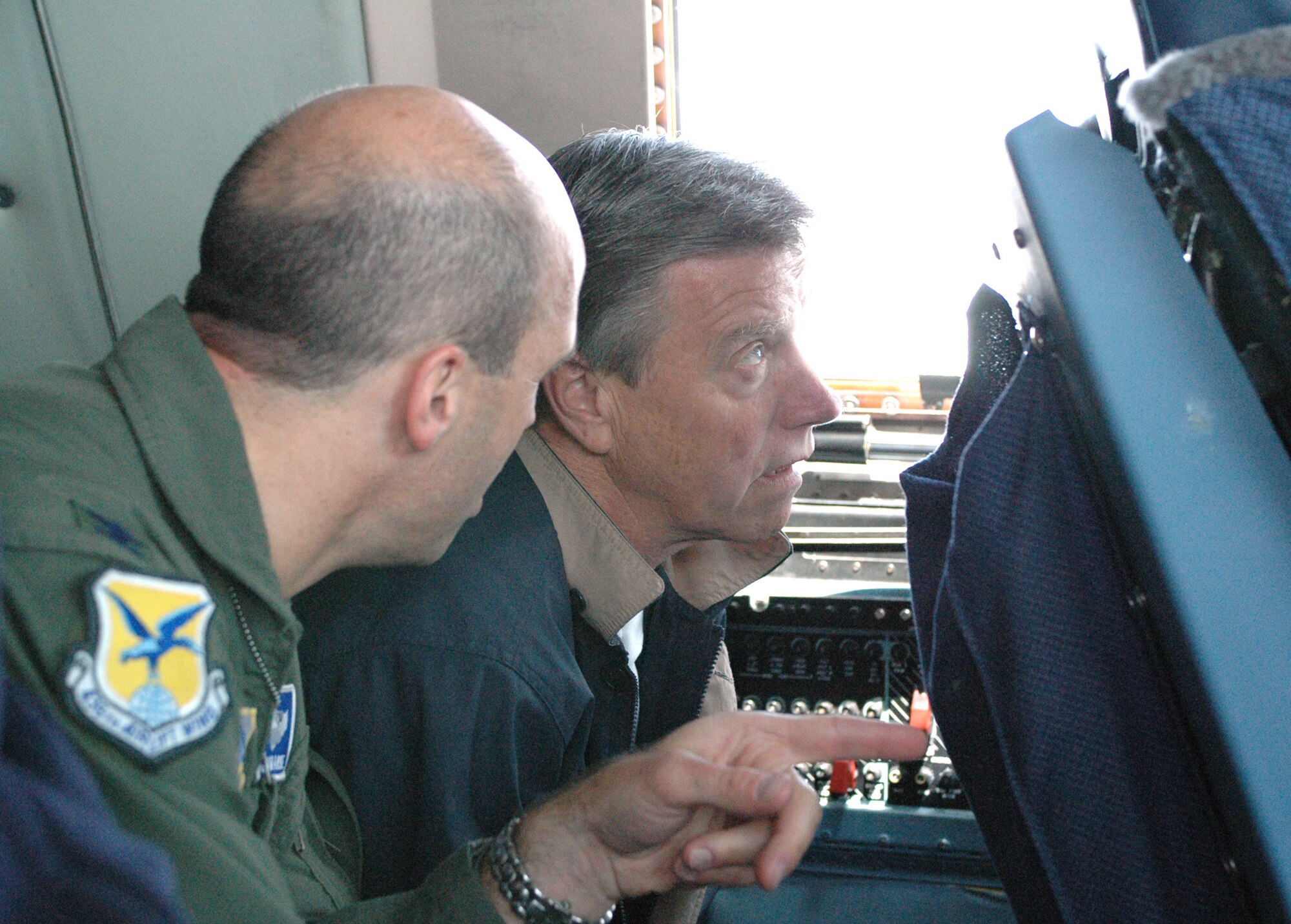 DOVER AIR FORCE BASE, Del. -- The 512th Airlift Wing, an associate Reserve unit of Air Force Reserve Command,  teamed up with the 436th AW to give honorary commanders an orientation flight aboard the C-5 Galaxy May 17. Col. Chad Manske, 436th AW vice commander, explains the air refueling process to Russell Larson, the Controller General for the State of Delaware and 709th Airlift Squadron honorary commander. The base's Honorary Commander Program is a partnership effort between community and base leaders. (U.S. Air Force photo/1st Lt. Marnee A.C. Losurdo)