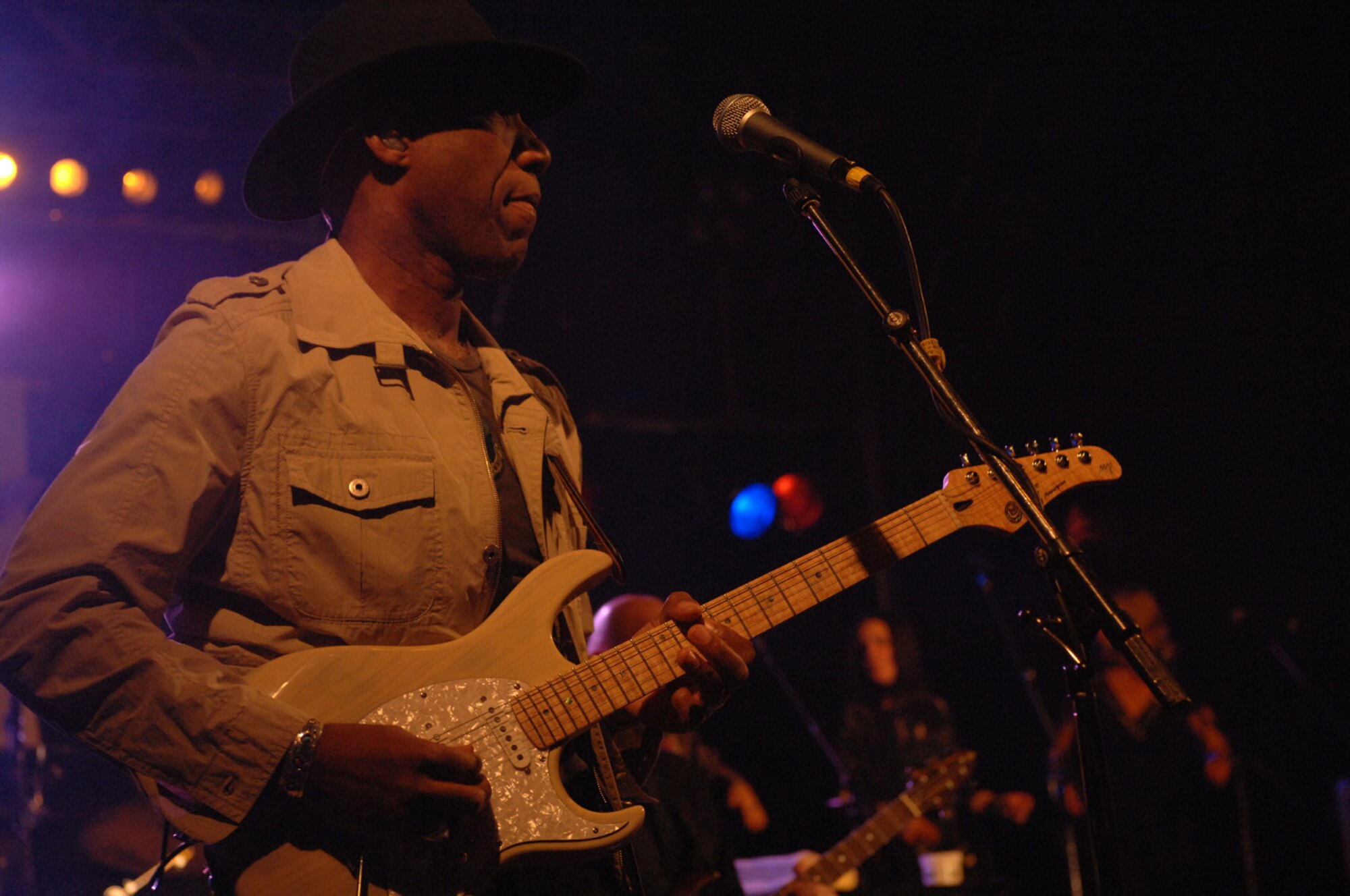 SPANGDAHLEM AIR BASE, GERMANY -- Kimo Williams, Lt. Dan Band electric guitarist and vocals, performs at Spangdahlem Air Base May 15. Mr. Williams is the son of a career an Airman, who enlisted in the Army July 4, 1969. He was assigned to a combat engineer company building roads and clearing land in the jungle in Viet Nam in 1970. To deal with the stress of combat he took to the guitar and was discovered by an Army entertainment director who suggested that he form a band to perform for the troops in the field. For the next two months Mr. Williams and his band, "The Soul Coordinators" traveled to remote fighting areas throughout Viet Nam. (US Air Force photo/Airman 1st Class Stephanie Moore)