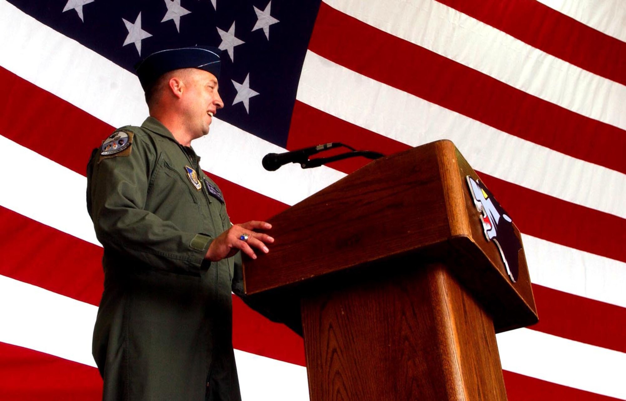 Colonel Jon Norman, former 8th Operations Group commander, speaks to his group and fellow Wolf Pack members one last time during the change of command ceremony here May 18. He continues his career as the next commander of the 51st Fighter Wing, Osan Air Base, Republic of Korea. (U.S. Air Force photo/Senior Airman Steven Doty)