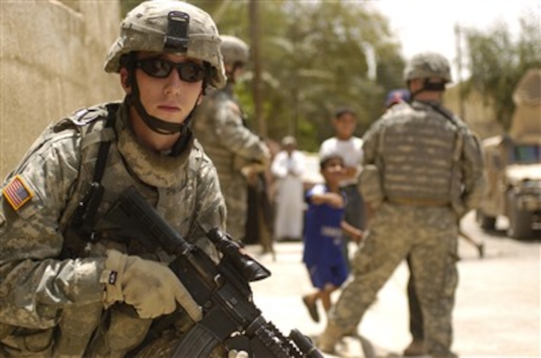 A U.S. Army soldier provides security during a house-to-house search for illegal weapons, explosives and high value targets in the Sadiyah section of Baghdad, Iraq, on May 6, 2007.  The soldier is assigned to Charlie Company, 1st Battalion, 18th Infantry Regiment, 2nd Brigade Combat Team, 1st Infantry Division.  