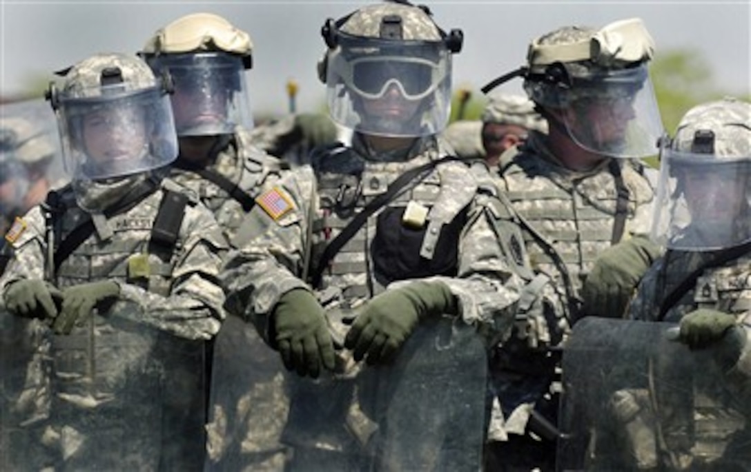 U.S. Army soldiers from the 1144th Transportation Battalion, Illinois Army National Guard conduct non-lethal weapons training at Camp Atterbury, Ind., on May 8, 2007.  The soldiers are being trained by U.S. Army Operation Warrior Trainers.  