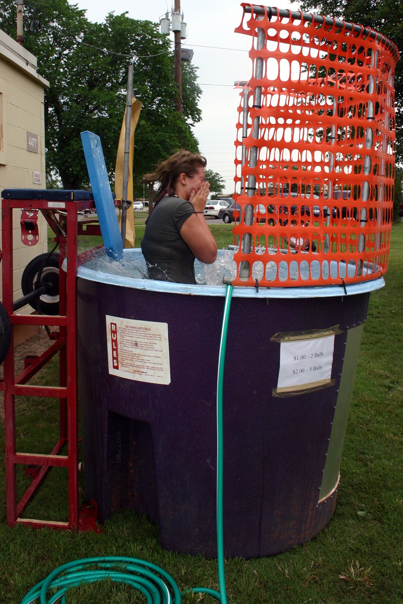 Airman 1st Class Melissa Morgan, 982nd Training Squadron, takes a plunge into the dunk tank at the Armed Forces Day picnic May 18. (U.S. Air Force photo/Staff Sgt. Tonnette Thompson)