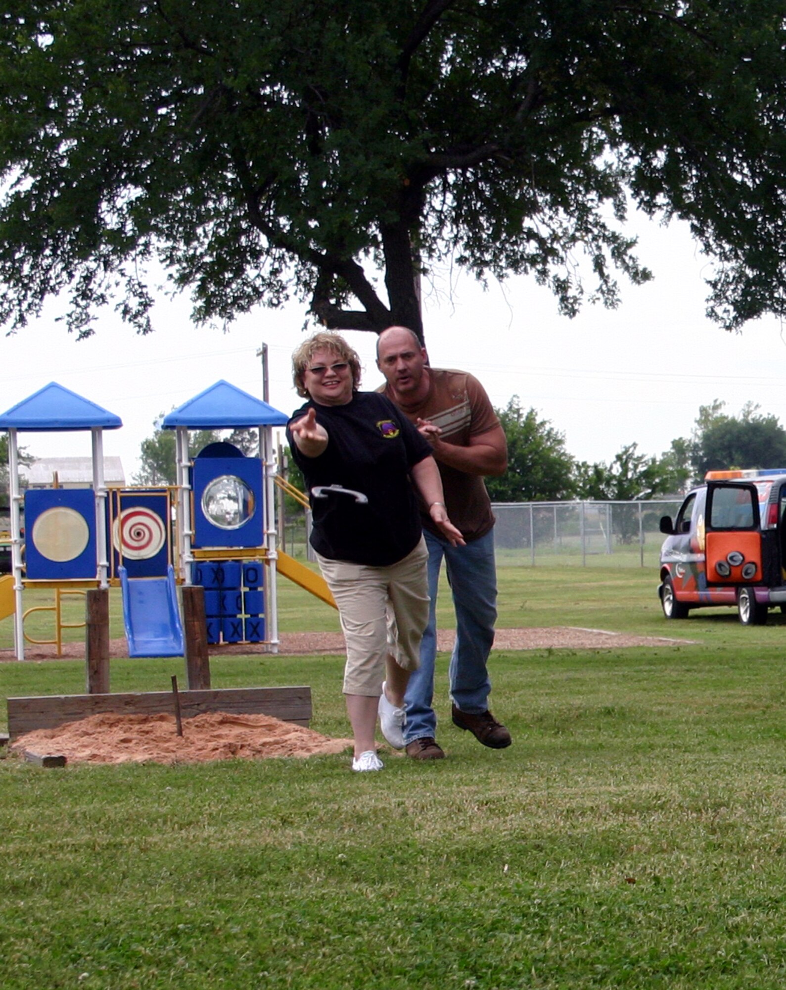 82nd Logisitics Readiness Squadron support group managers Barbara Ashby and Steven Bennett participate in a game of horseshoes during the Armed Forces Day picnic May 18. (U.S. Air Force photo/Staff Sgt. Tonnette Thompson)