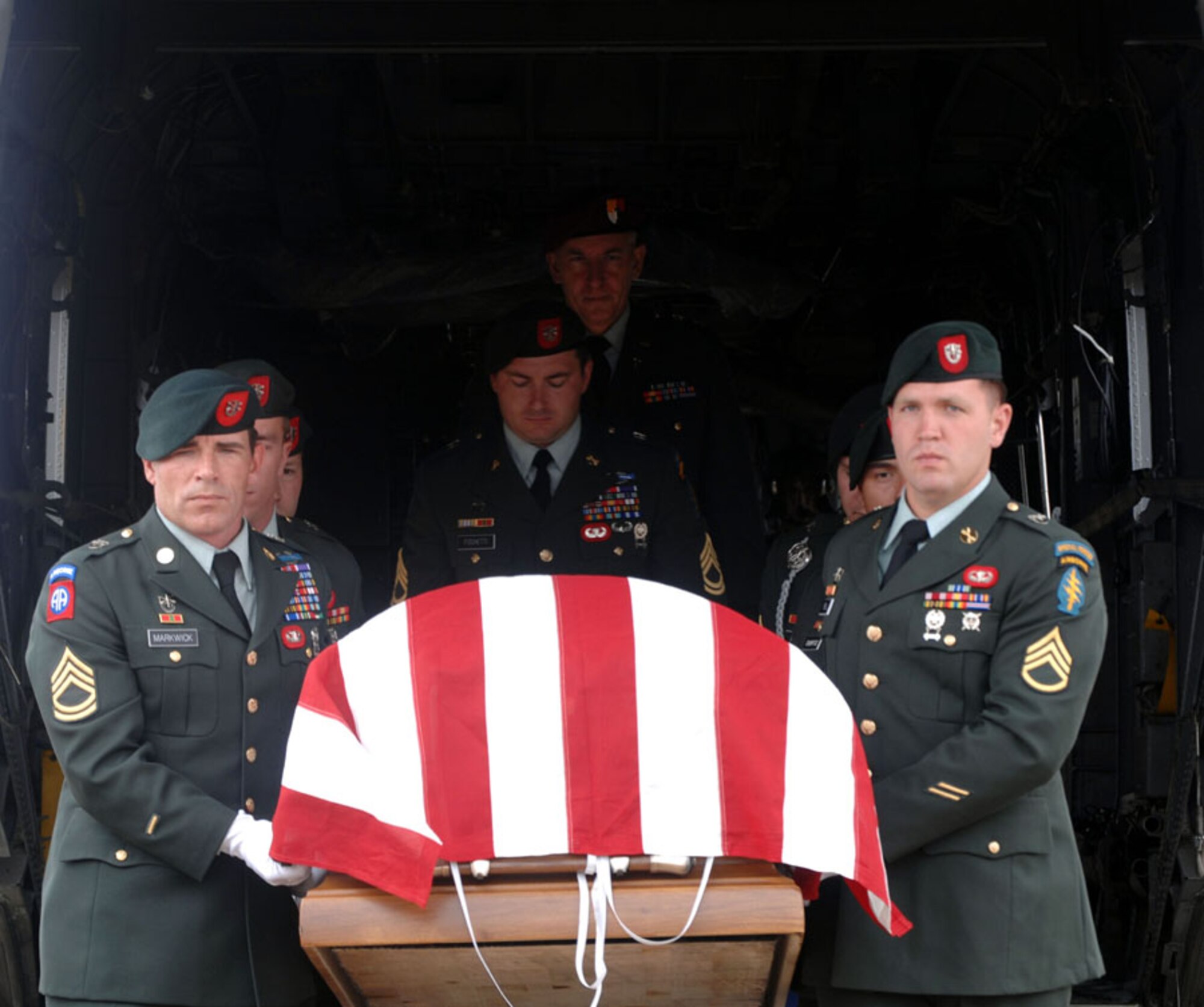 U.S. Army Special Forces Soldiers carried the casket of Army Sgt. Tim Padgett from the back of an MH-53 PAVE LOW when it arrived in DeFuniak Springs May 14. Sergeant Padgett was killed May 8 in Afghanistan. The Soldiers are assigned to the 1st Battalion, 7th Special Forces Group at Fort Bragg, N.C. (U.S. Air Force photo by Senior Airman Cynthia Morrow)