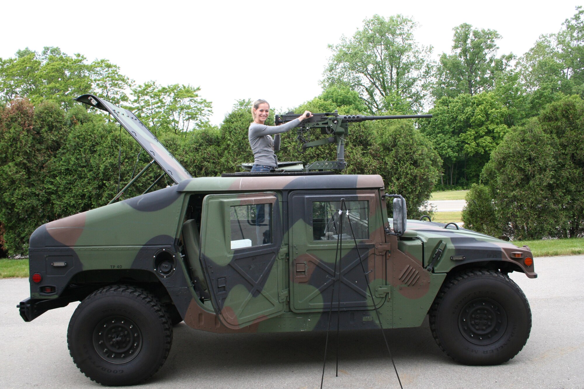 WRIGHT-PATTERSON AFB, Ohio - Leslie Adams takes aim on a M-2 50 caliber machine gun mounted on a humvee.  She was one of approximately 40 employers who visited the Air Force Reserve’s 445th Airlift Wing on Employers Day.  The day is to inform employers of some of the duties and equipment used by Air Force reservists on training drill weekends and when deployed. (U.S. Air Force photo/Maj. Ted Theopolos)