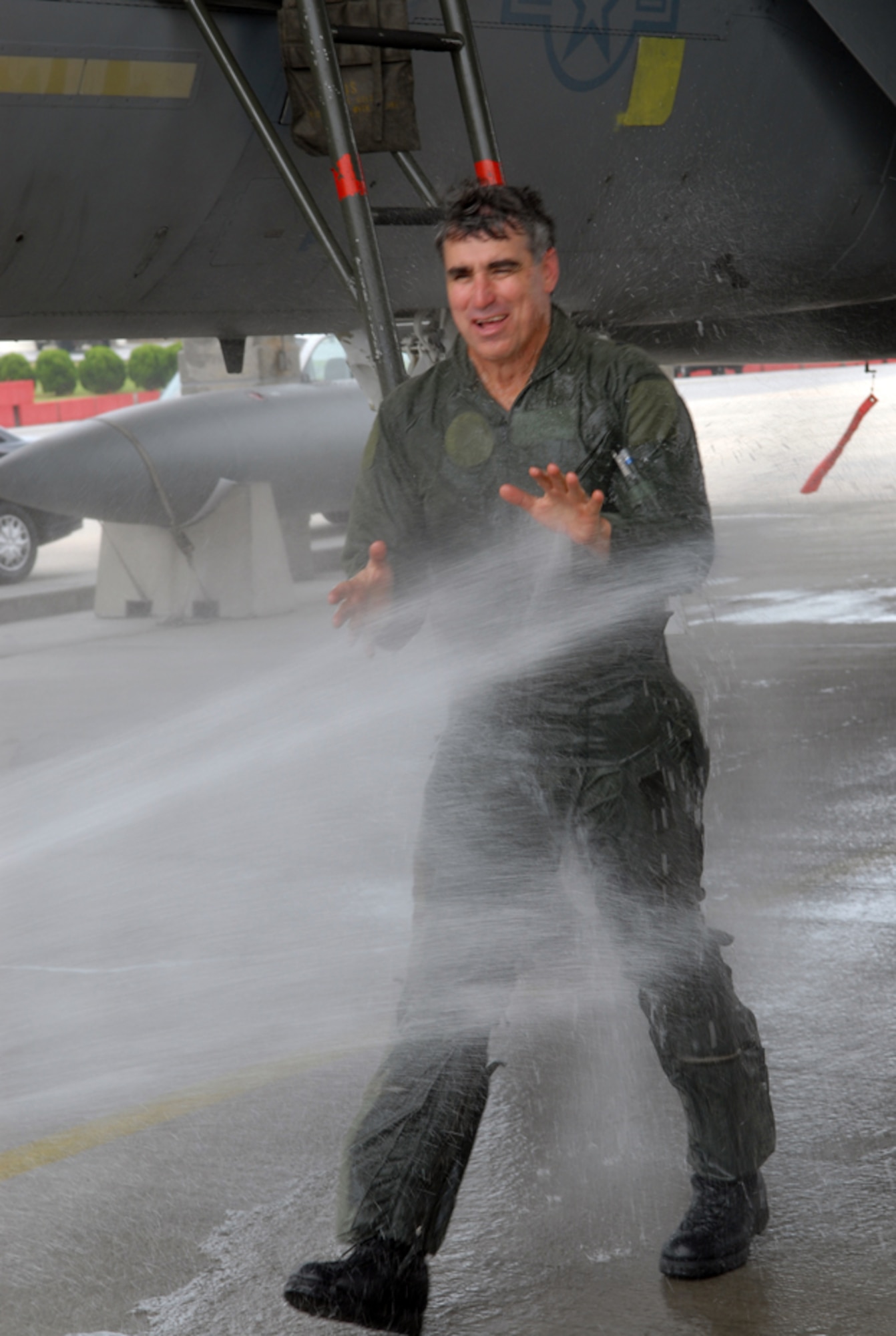 Brig. Gen. Harold “Punch” Moulton receives the traditional wet down after departing his F-15E. Junior lieutenants from the wing were selected to man the fire hose for this special occasion. General Moulton will soon move on to Osan AB, Korea, where he will fill the roles of 7th Air Force and U.S. Air Forces Korea vice commander, and Air Component Command chief of staff. The general will be succeeded by Brig. Gen. Brett Williams who previously served as Air Combat Command Inspector General at Langley Air Force Base, Va. (U.S. Air Force/Staff Sgt. Steven Nabor)