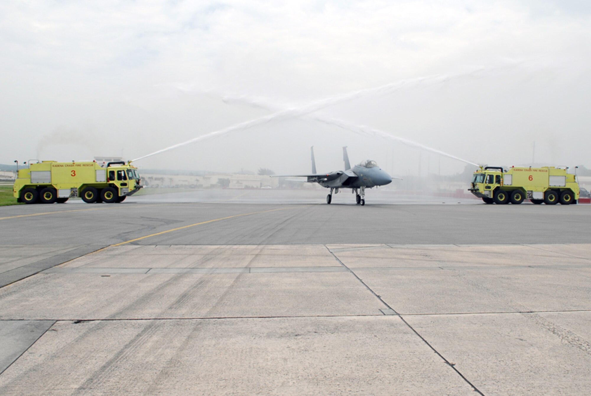 Brig. Gen.  Harold “Punch” Moulton 18th Wing commander, taxies his F-15E through two fire trucks in dedication of his last flight with the 44th Fighter Squadron at Kadena AB, Japan. General Moulton will soon move on to Osan AB, Korea, where he will fill the roles of 7th Air Force and U.S. Air Forces Korea vice commander, and Air Component Command chief of staff. The general will be succeeded by Brig. Gen. Brett Williams who previously served as Air Combat Command Inspector General at Langley Air Force Base, Va.
(U.S. Air Force/Staff Sgt. Steven Nabor)