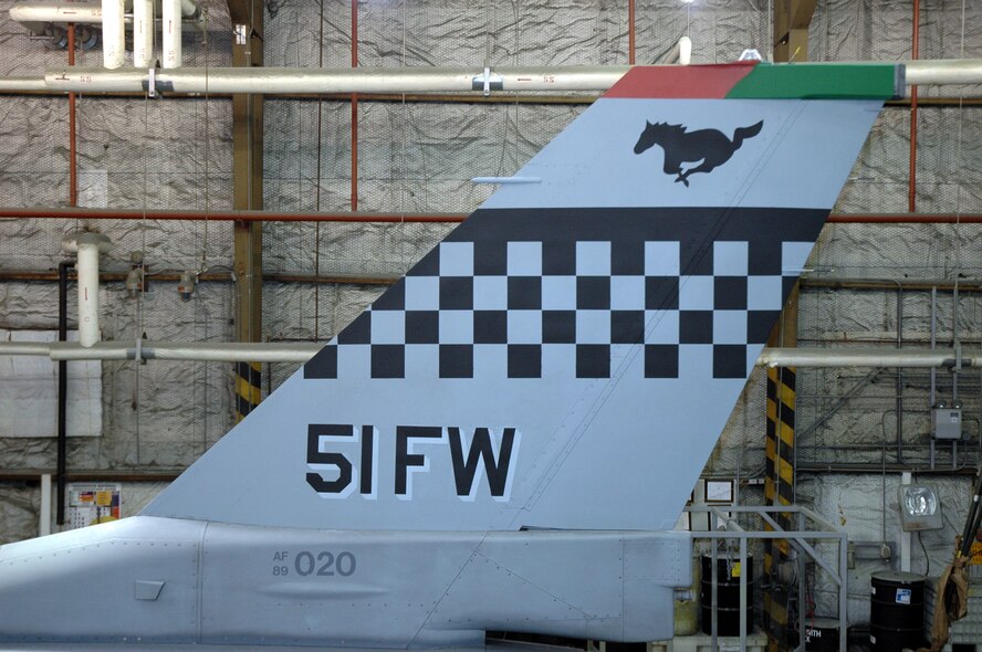 OSAN AIR BASE, Republic of Korea --  The new Korean Conflict-era "Checkertail" design on Brig. Gen. Joe Reynes' F-16 Fighting Falcon. The 51st Maintenance Squadron's corrosion element is painting the design on five command jets here. (U.S. Air Force photo by Tech. Sgt. Michael O'Connor)