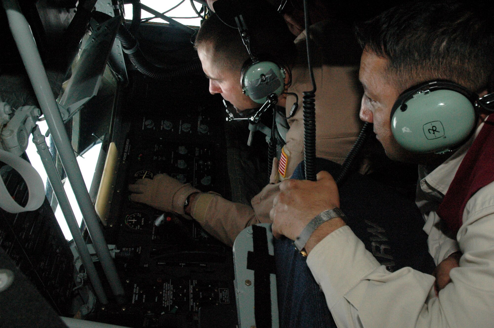 Staff Sgt. Michael Brooks demonstrates the operation of the boom system of the KC-135 Stratotanker to Marat Usupov, the advisor to the Kyrgyz Ministry of Foreign Affairs May 19 above Kyrgyzstan. The demonstration was a part of an orientation flight given to 10 Kyrgyz Republic government leaders. The mission of the 376th Air Expeditionary Wing is to deliver passengers, fuel and cargo into and out of Afghanistan in support of Operation Enduring Freedom. Sergeant Brooks is a 22nd Expeditionary Air Refueling Squadron boom operator deployed from the 92nd Air Refueling Wing at Fairchild Air Force Base, Wash. (U.S. Air Force photo/Master Sgt. Daniel Nathaniel)
