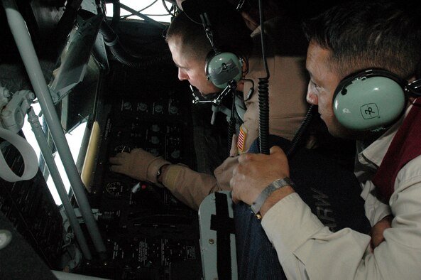 Staff Sgt. Michael Brooks demonstrates the operation of the boom system of the KC-135 Stratotanker to Marat Usupov, the advisor to the Kyrgyz Ministry of Foreign Affairs May 19 above Kyrgyzstan. The demonstration was a part of an orientation flight given to 10 Kyrgyz Republic government leaders. The mission of the 376th Air Expeditionary Wing is to deliver passengers, fuel and cargo into and out of Afghanistan in support of Operation Enduring Freedom. Sergeant Brooks is a 22nd Expeditionary Air Refueling Squadron boom operator deployed from the 92nd Air Refueling Wing at Fairchild Air Force Base, Wash. (U.S. Air Force photo/Master Sgt. Daniel Nathaniel)