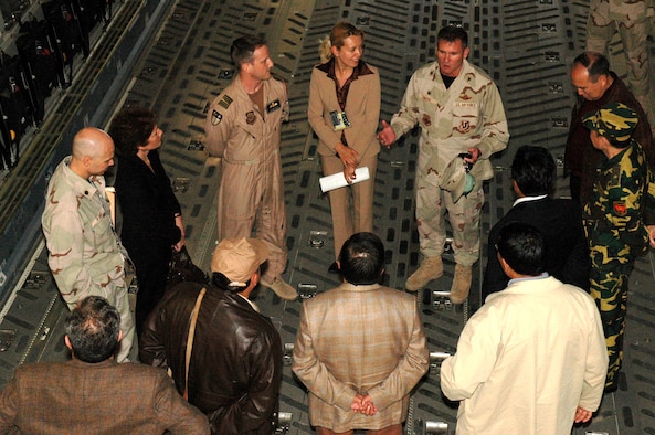 Col. Scott Reese explains the capabilities and mission requirements of the C-17 Globemaster III to Kyrgyz Republic government leaders during a tour of the aircraft prior to a May 19 orientation flight at Manas Air Base, Kyrgyzstan. The mission of the 376th Air Expeditionary Wing is to deliver passengers, fuel and cargo into and out of Afghanistan in support of Operation Enduring Freedom. Colonel Reese is the 376th AEW commander. (U.S. Air Force photo/Master Sgt. Daniel Nathaniel)