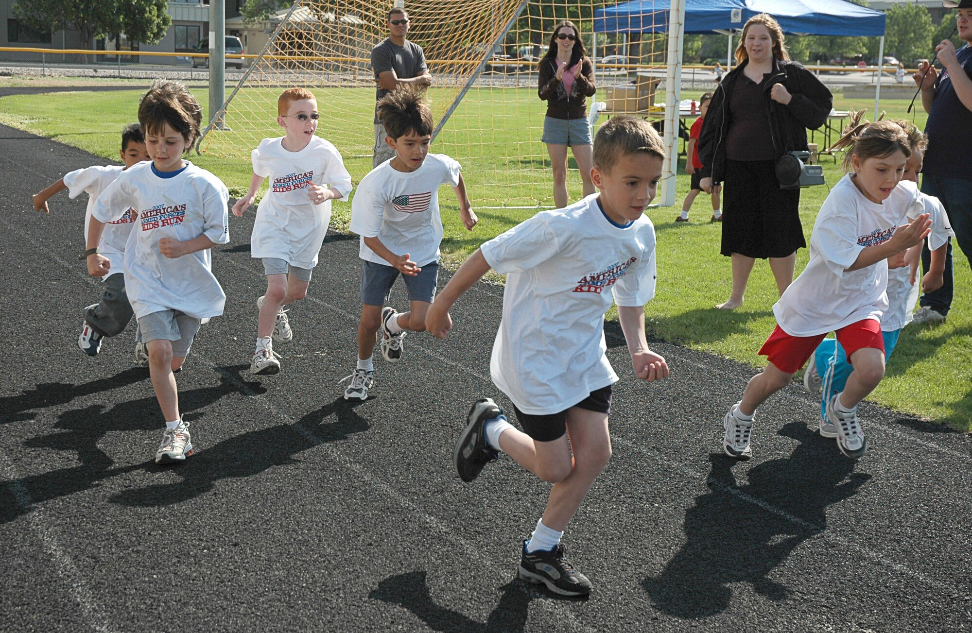 MOUNTAIN HOME AIR FORCE BASE, Idaho -- Boys and girls begin a mile run at the base fitness center as part of the America’s Armed Forces Kids Run here May 19. Held in conjunction with Armed Forces Day, the run is geared for children ages five and up to promote a more active lifestyle, according to Lissa Hall, Boys and Girls Club coordinator with the youth center here. U.S. Air Force photo/Airman Samantha S. DeVries