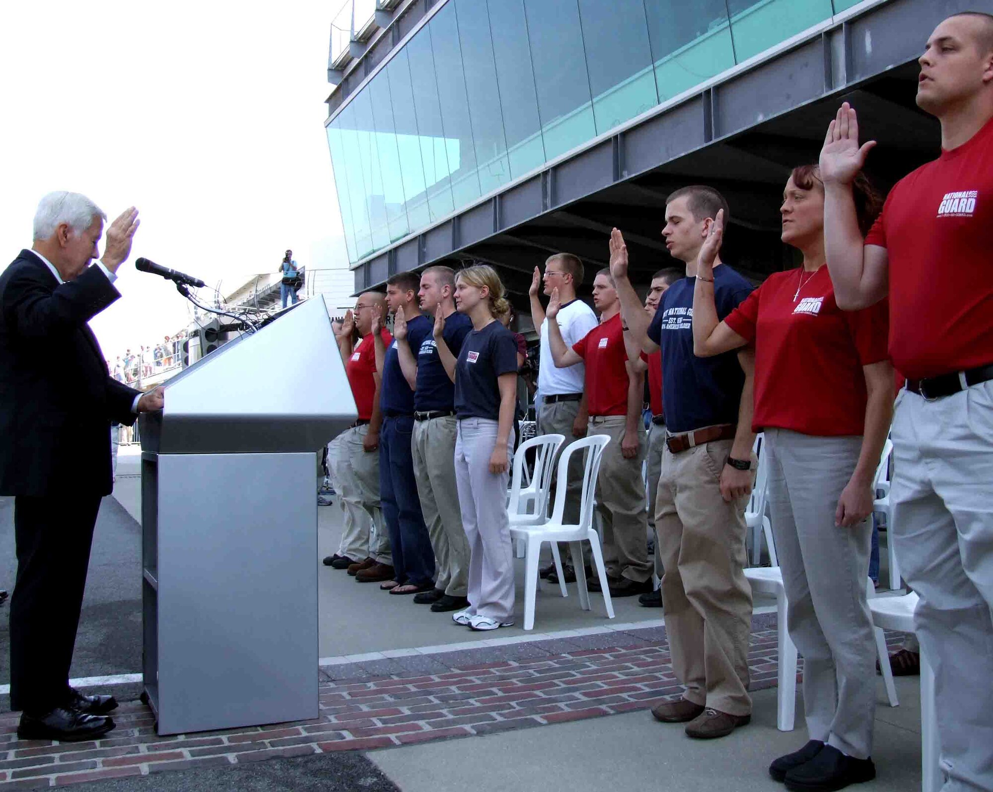 U.S. Sen. Richard G. Lugar of Indiana gives the oath of enlistment as 61 young people raise their right hands to join the Army, Navy, Marines, Air Force or Coast Guard on May 20 at Indianapolis Motor Speedway. (Department of Defense photo/Gerry J. Gilmore)