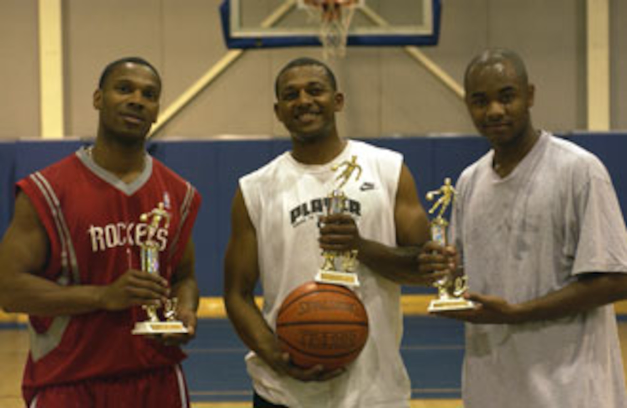 The 452nd All Star team took the top spot at the first Fit to Fight - Keep Moving Initiative event, a 3-on-3 double elimination basketball tournament. (Left to right) Will Horton, 452nd Aerospace Medicine Squadron, Willie Carter, 452nd AMDS and Dwayne Daniels, 452nd Services Squadron.  Four teams entered the AFRC initiated games, battling it out in a first to 15 double elimination tournament held at March Air Reserve Base.  (U.S. Air Force photo by Tech. Sgt Mike Blair)
