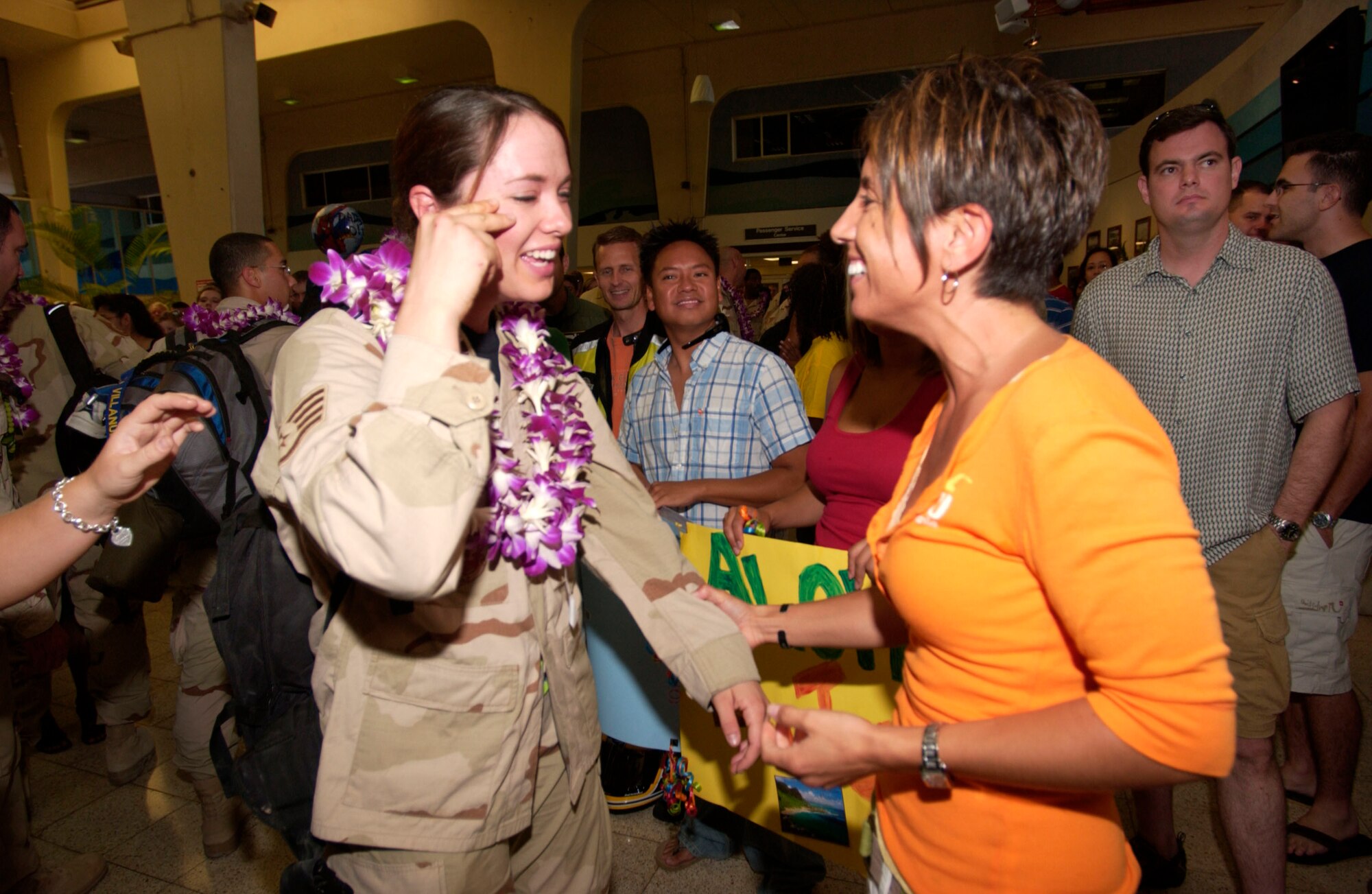 There were not too many dry eyes in the Air Mobility Terminal Saturday morning.  Staff Sgt.  Jenny Fritcher, 65th Airlift Squadron, and friend, Staff Sgt. Michelle Gattey, 65th AS. 