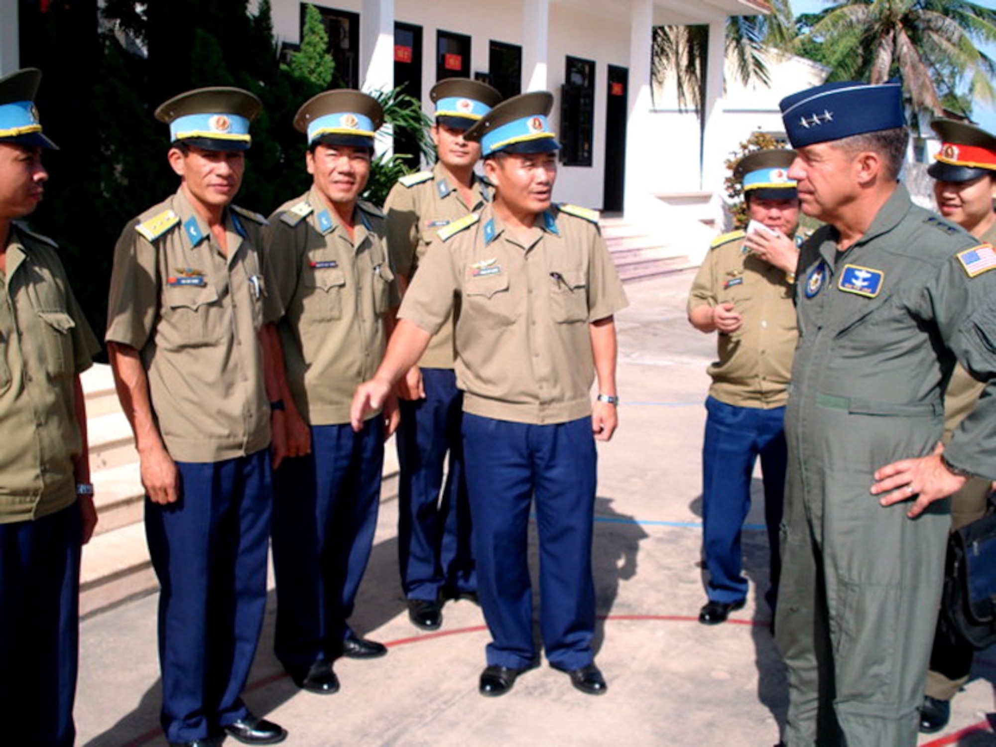 Lt. Gen. Dan Leaf discusses pilot training with staff instructors during a visit to the Vietnamese air force academy at Nha Trang Air Base located in the Khanh Hoa province on the central coast.  General Leaf was in Vietnam to meet with military and civilian officials to identify possible future military engagement activities.  (U.S. Air Force photo)
