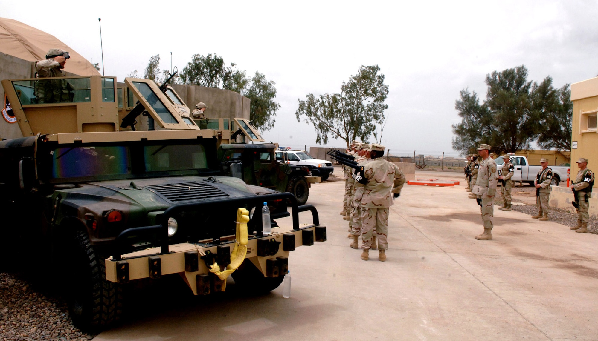 Airmen of the 332nd Expeditionary Security Forces Squadron provide a 21-gun salute for Staff Sgt. John Self during a May 18 memorial ceremony at Balad Air Base, Iraq. Sergeant Self died during combat operations May 14 in the Baghdad area. (U.S. Air Force photo/Airman 1st Class Jonathan Steffen) 
