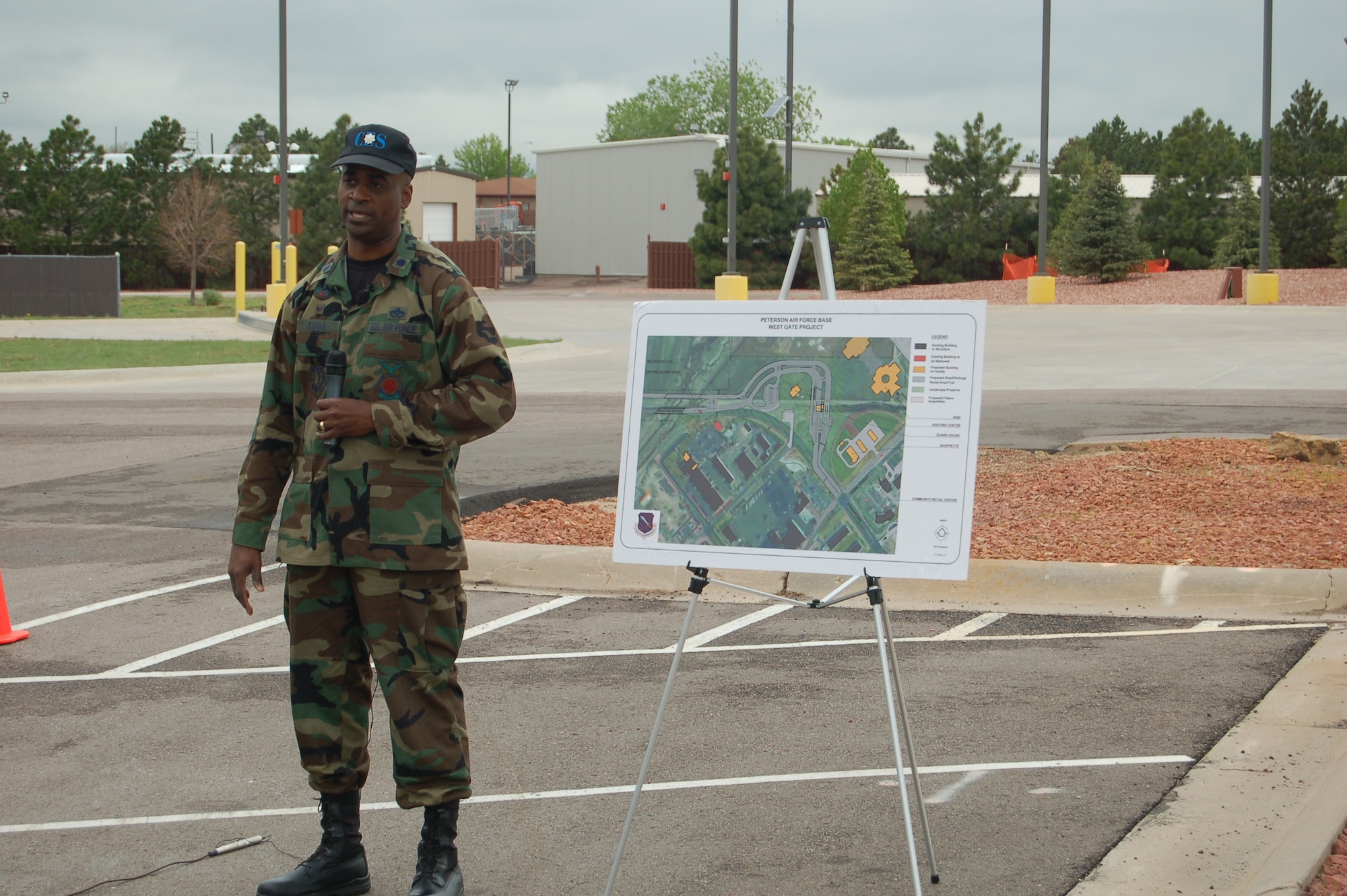 Lt. Col. Derrek Sanks, 21st Space Wing Civil Engineering Squadron commander, talks about gate changes May 15 near the West Gate. Changes at the West Gate will include more lanes and a new visitor center. (U.S. Air Force photo by Corey Dahl)