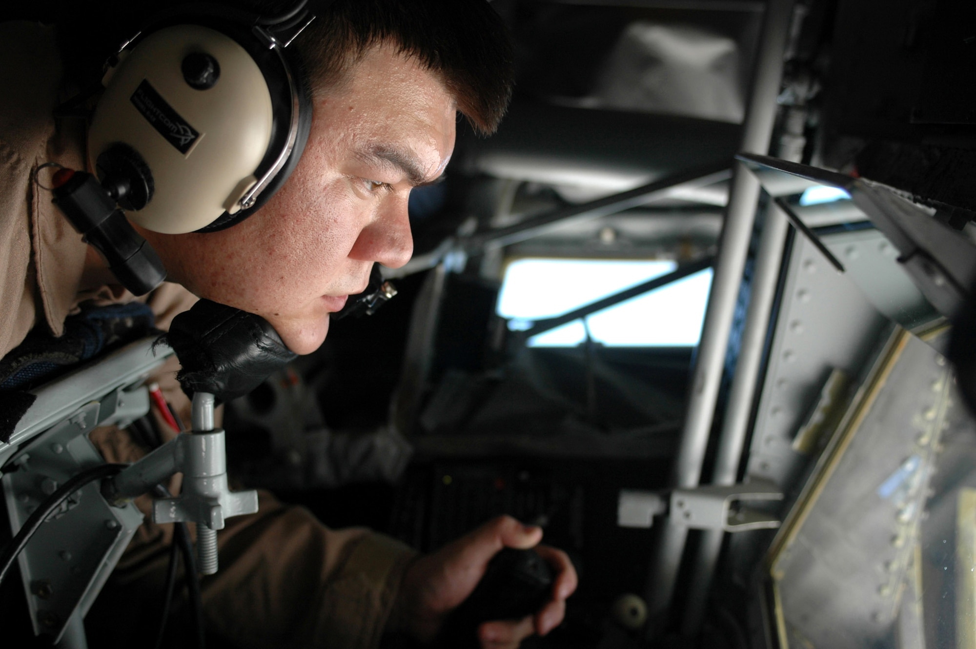 Airman 1st Class Larry Hamel refuels an F-16 Fighting Falcon from a KC-135 Stratotanker over central Iraq May 19. Airman Hamel is a 340th Expeditionary Air Refueling Squadron boom operator deployed from Fairchild Air Force Base, Wash. The KC-135's principal mission is air refueling. This unique asset greatly enhances the Air Force's capability to accomplish its primary missions of global reach and global power. Nearly all internal fuel can be pumped through the flying boom, the KC-135's primary fuel transfer method. (U.S. Air Force photo/Senior Airman Erik Hofmeyer)
