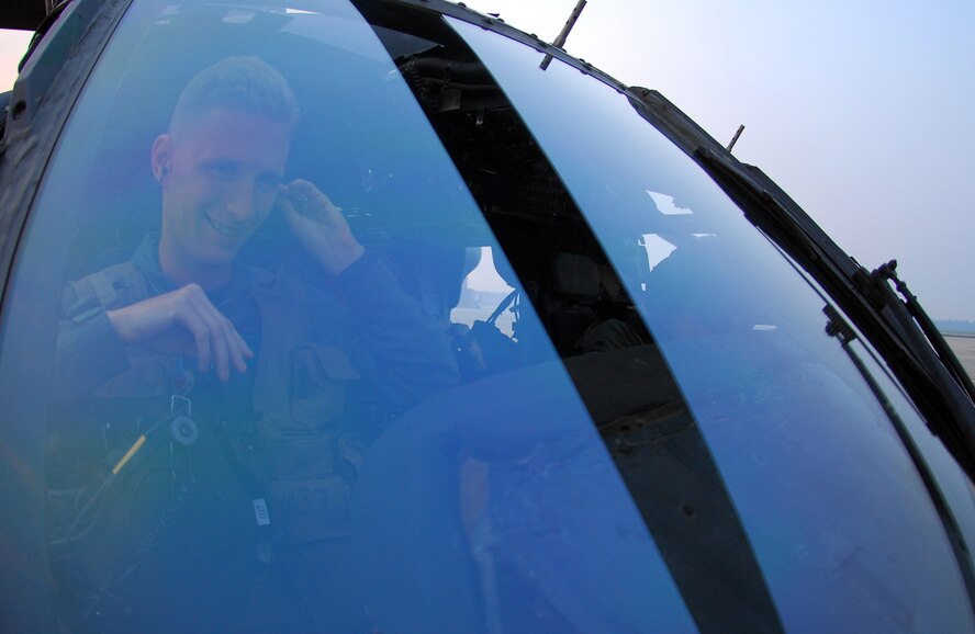 MOODY AIR FORCE BASE, Ga, --   Capt. Jason Rodgers, an HH-60G Pave Hawk pilot assigned to Moody's 41st Rescue Squadron, prepares before a night training mission May 15. The 41st RQS "Jolly Green Giants" routinely fly night missions to maintain proficiency in their primary mission - combat search and rescue.  (U.S. Air Force photo by Tech. Sgt. Parker Gyokeres) 