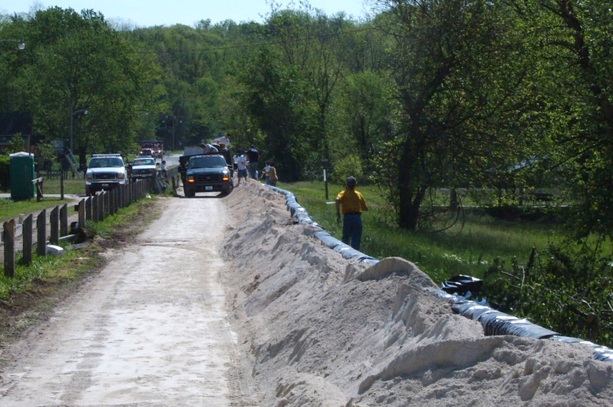 WHITEMAN AFB, Mo. – Six members of the 72d Test and Evaluation Squadron, volunteered to help Rocheport, Missouri’s cry for help when the area received as much as 8 inches of rain in a 24-hour period during weekend thunderstorms. If the small town of 208 residents flooded, hundreds of thousands of dollars would be lost to property damage, not to mention the devastating loss of irreplaceable sentimental items. Experts predicted an estimated 15,000, 30-50 pound sandbags would be needed to hold back the rising waters.  This sandbag levee was used to guard against a river crest of 34 feet which was 13 feet above flood stage. (U.S. Air Force photo/Staff Sgt. Jeffrey Heying)