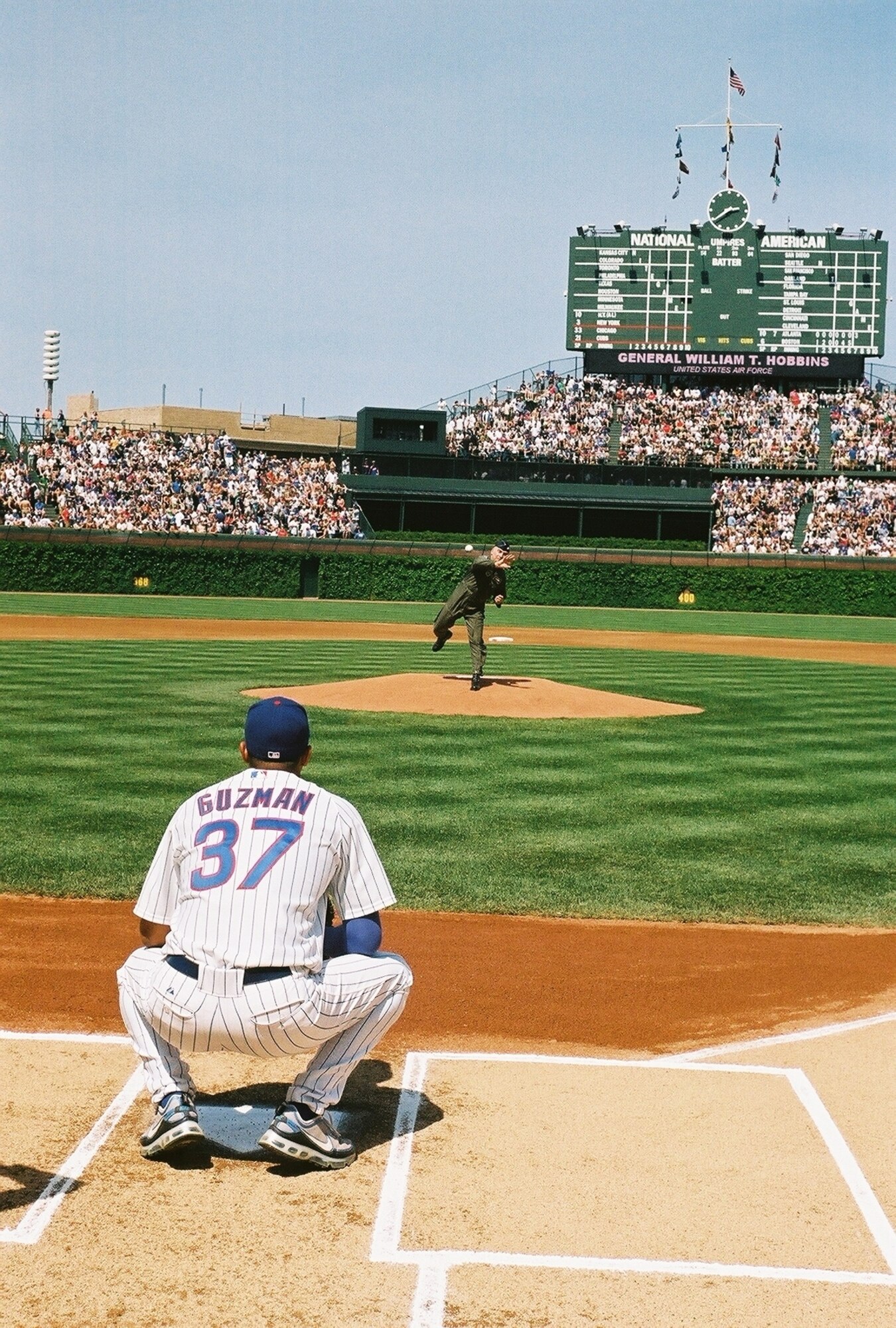 CHICAGO, Illinois – Gen. Tom Hobbins, U.S. Air Forces in Europe commander, throws out the first pitch to Cubs Pitcher Angel Guzman during the Chicago Cubs vs White Sox baseball game May 19 at Wrigley Field in support of Armed Forces Week.  More than 41,000 people attended the sold-out game. (Air Force photos by Russ Maheras)
