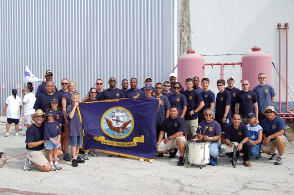 Sailors from Helicopter Sea Combat Squadron-Two Five pose after placing third in the Continental Airlines Plane Pull.