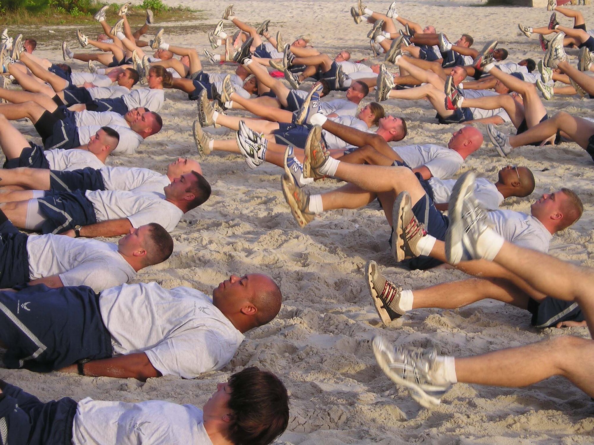 Airmen from the 36th Contingency Response Group conduct a morning workout at Tarague Beach to stay “Fit to Fight.” The 36 CRG's physical training is structured to keep the Airmen from the group in top physical condition and ready to respond to any call short-notice deployment. The groups’ structured PT involves the entire squadron and works to bolster morale as well as to stay in shape.  (Courtesy Photo)