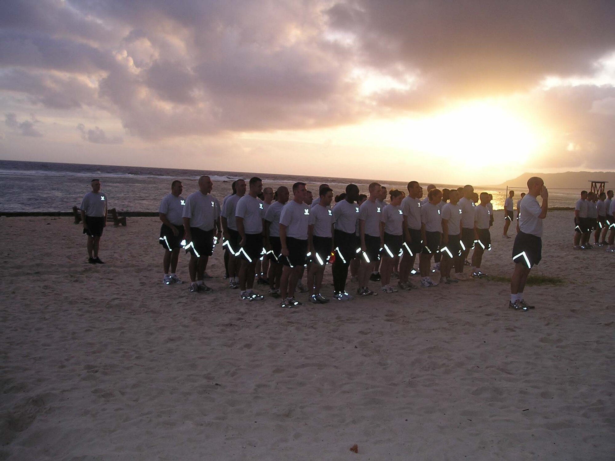 Airmen from the 36th Contingency Response Group conduct a morning workout at Tarague Beach to stay “Fit to Fight.” The 36 CRG's physical training is structured to keep the Airmen from the group in top physical condition and ready to respond to any call short-notice deployment. The groups’ structured PT involves the entire squadron and works to bolster morale as well as to stay in shape.  (Courtesy Photo)
