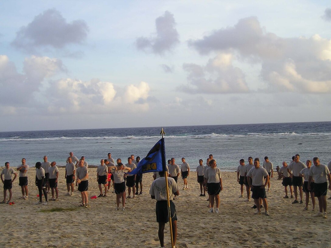 Airmen from the 36th Contingency Response Group conduct a morning workout at Tarague Beach to stay “Fit to Fight.” The 36 CRG's physical training is structured to keep the Airmen from the group in top physical condition and ready to respond to any call short-notice deployment. The groups’ structured PT involves the entire squadron and works to bolster morale as well as to stay in shape.  (Courtesy Photo)