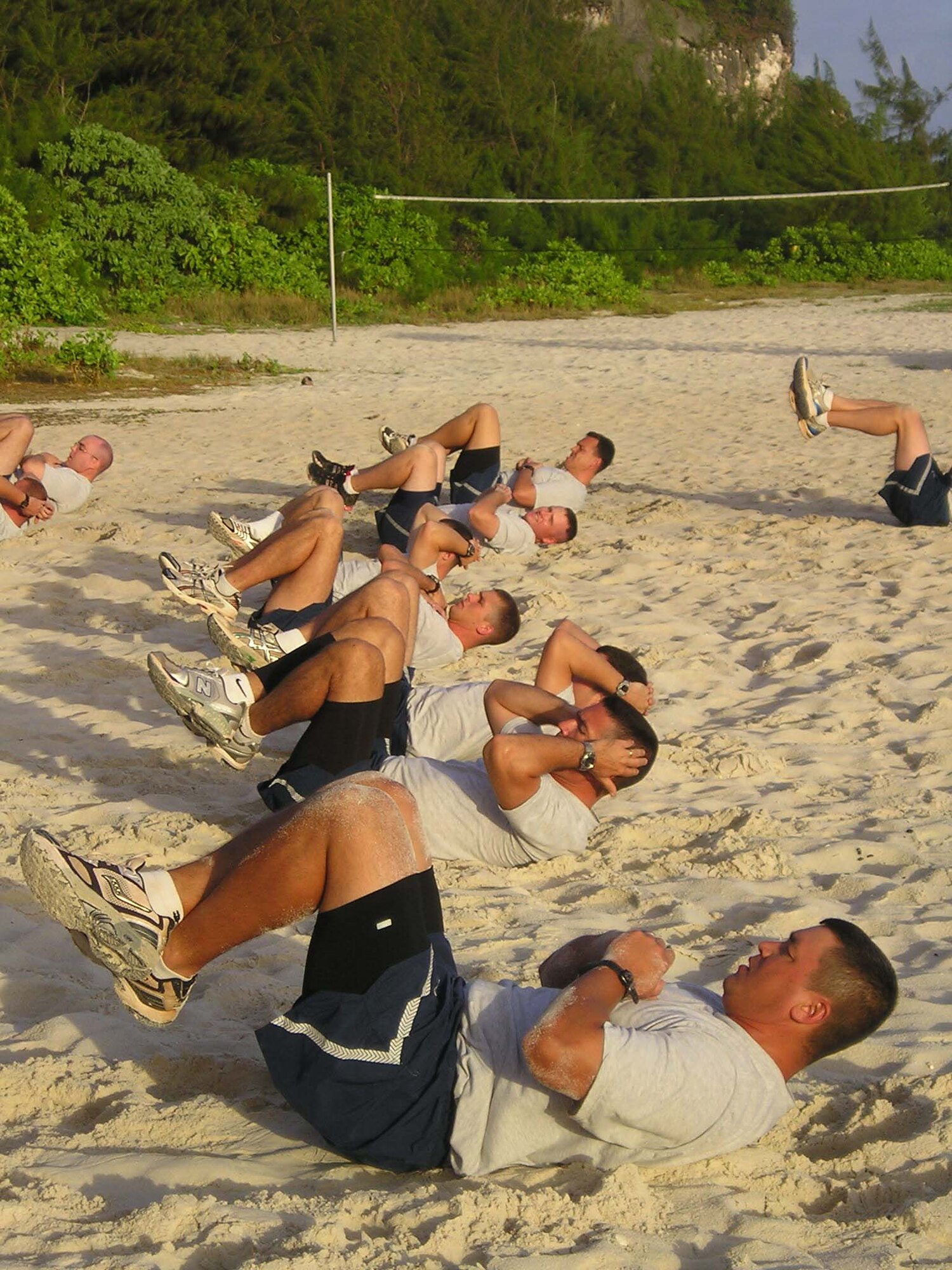 Airmen from the 36th Contingency Response Group conduct a morning workout at Tarague Beach to stay “Fit to Fight.” The 36 CRG's physical training is structured to keep the Airmen from the group in top physical condition and ready to respond to any call short-notice deployment. The groups’ structured PT involves the entire squadron and works to bolster morale as well as to stay in shape.  (Courtesy Photo)