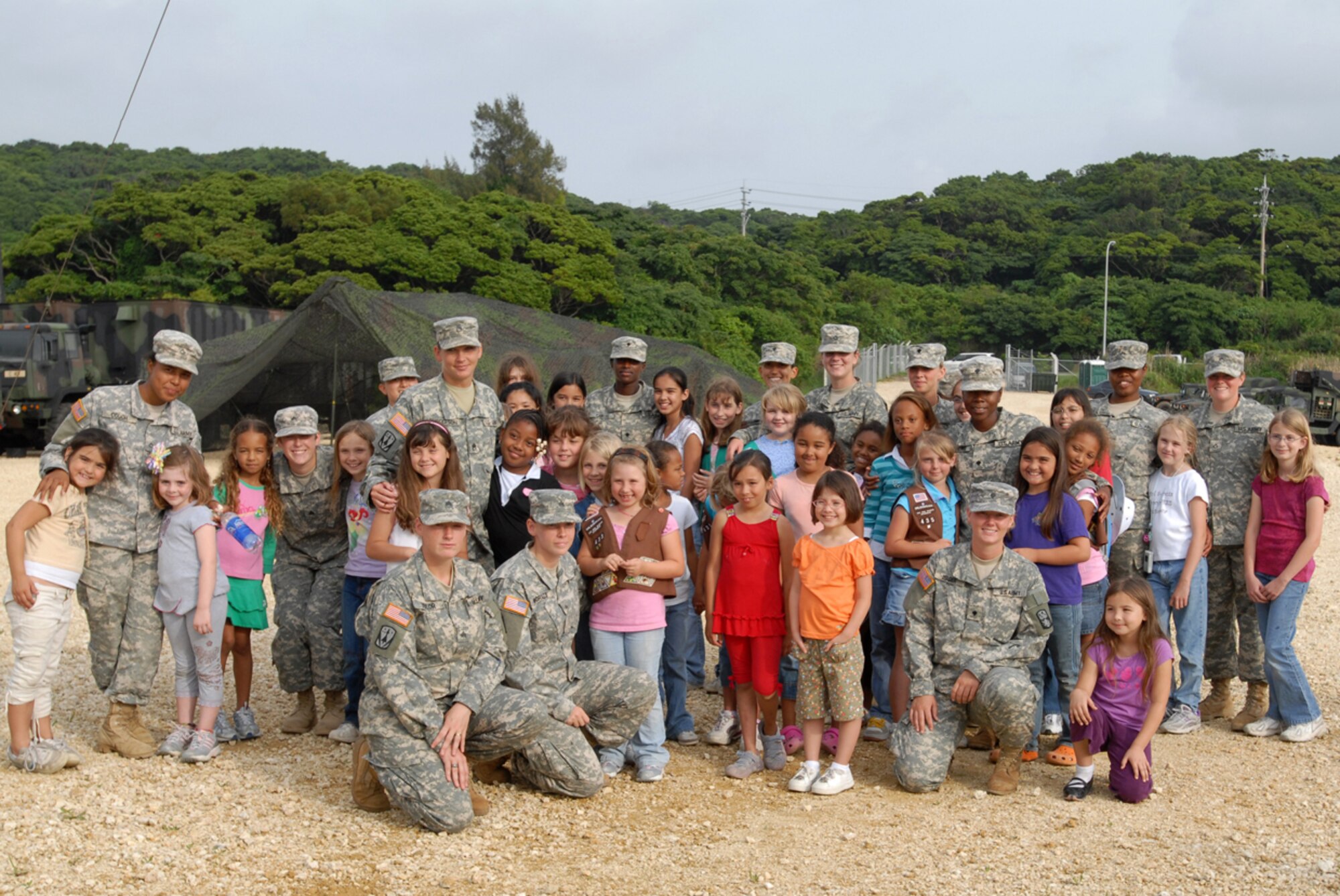 Girl Scouts from Troops 414, 432, 433, and 435 and the women from the 1-1 Air Defense Artillery Battalion pose for a group photo during a visit to the unit May 15. The purpose of the visit was to show the girls the importance of the unit in protecting them against any danger from our enemies, and to show that there are plenty of good women role models in the services they can look up to.
(U.S. Air Force/Airman 1st Class Kasey Zickmund)