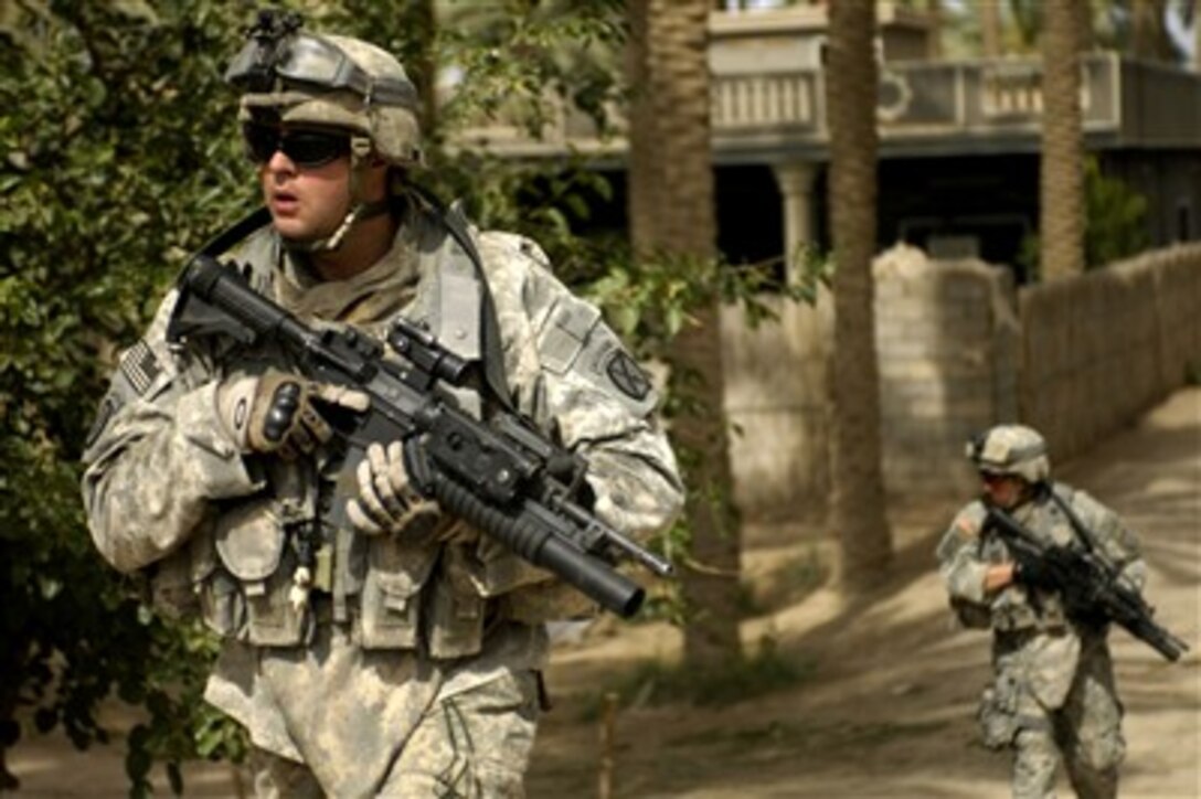 U.S. Army soldiers attached to the 4th Battalion, 31st Infantry Regiment search for three missing soldiers in the streets of Yusifiyah, Iraq, on May 14, 2007.  