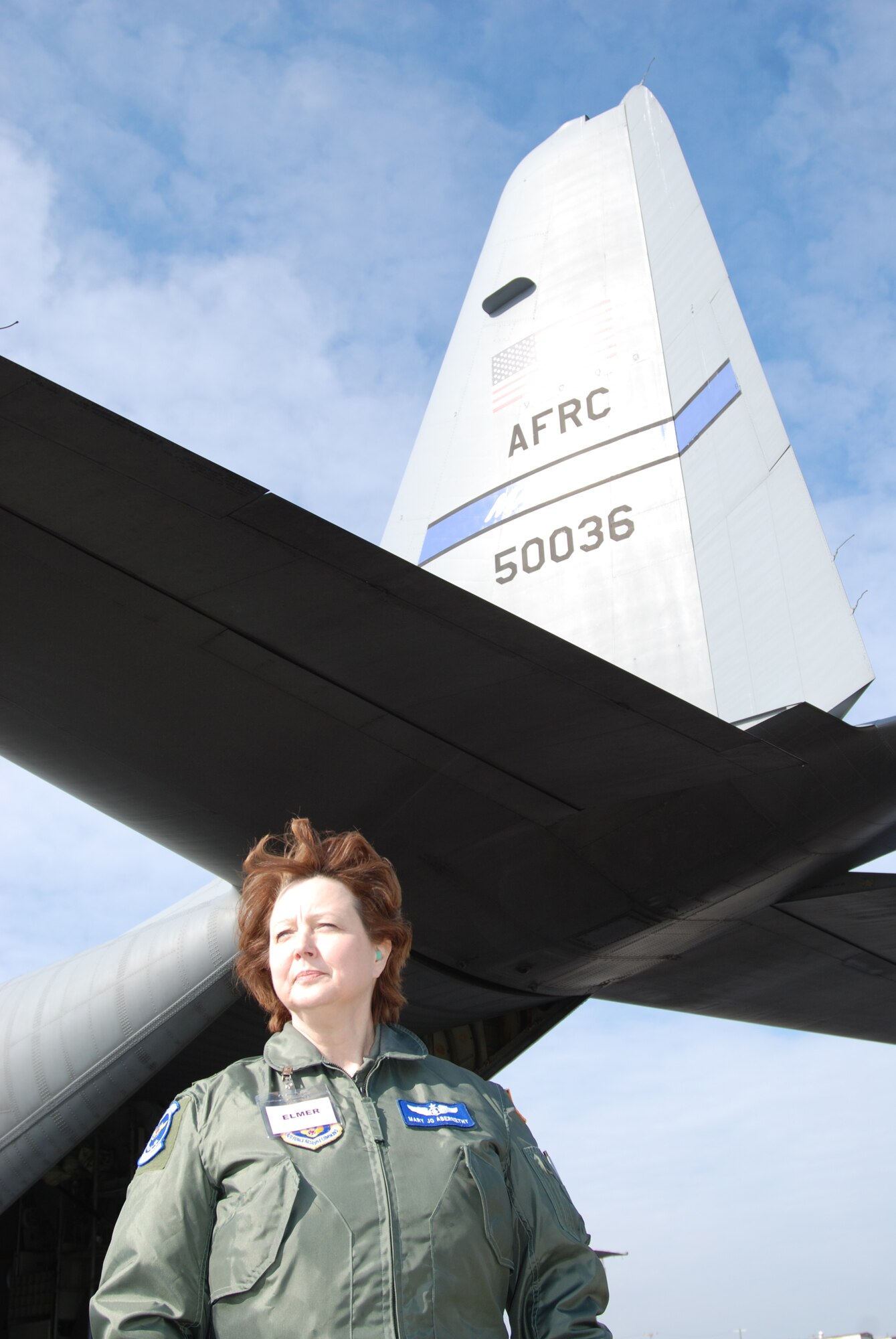 Lt. Col. Mary Jo Abernethy, 932nd Airlift Wing member and Aeromedical Evacuation Squadron public affairs representative, checks out a visiting C-130 during an excercise in Tennessee.  Photo/ Capt. Stan Paregien