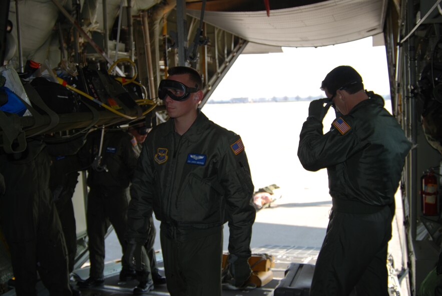 932nd Airlift Wing members step aboard a visiting C-130 from Maxwell Air Force Base during an Aeromedical Evacuation excercise recently.  Photo/ Capt. Stan Paregien
