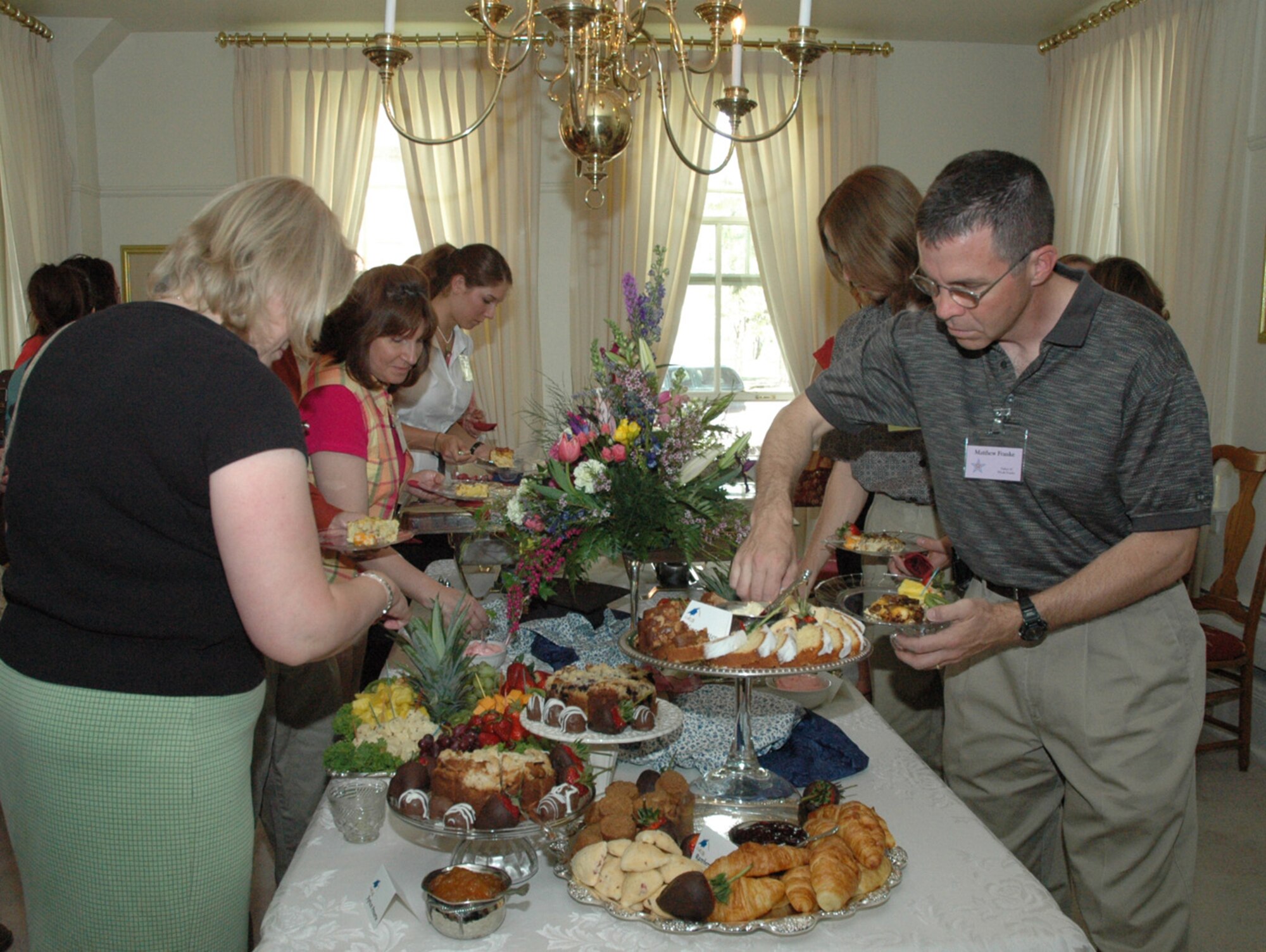 Chaplain (Maj.) Matthew Franke and Warren Spouse Club members enjoy a brunch buffet during the WSC Scholarship Brunch Saturday. Scholarship recipients and their families were recognized as well as all who were involved with the scholarship committee (Photo by Airman Alex Martinez).
