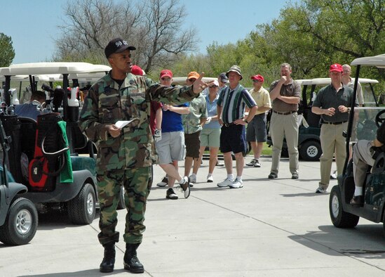 Chief Master Sgt. James Hunt, 90th Operations Group, greets and thanks participants of Warren's Chief and Sergeant Major Group Golf Tournament May 11. The tournament helped raise money for their scholarship fund (Photo by Airman Alex Martinez).
