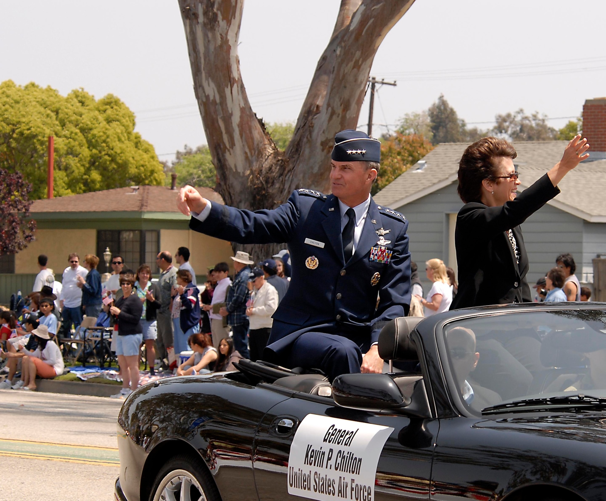 Gen. Kevin Chilton, Air Force Space Command commander, and his wife wave to the crowd durng the Torrance Armed Forces Day Parade. The general served as the parade's Grand Marshal. A Los Angeles AFB honor guard led the way as Los Angeles, Edwards, and Vandenberg Air Force Bases and March Air Reserve Base marched passed the crowds with a total of more than 300 airmen participating. 
