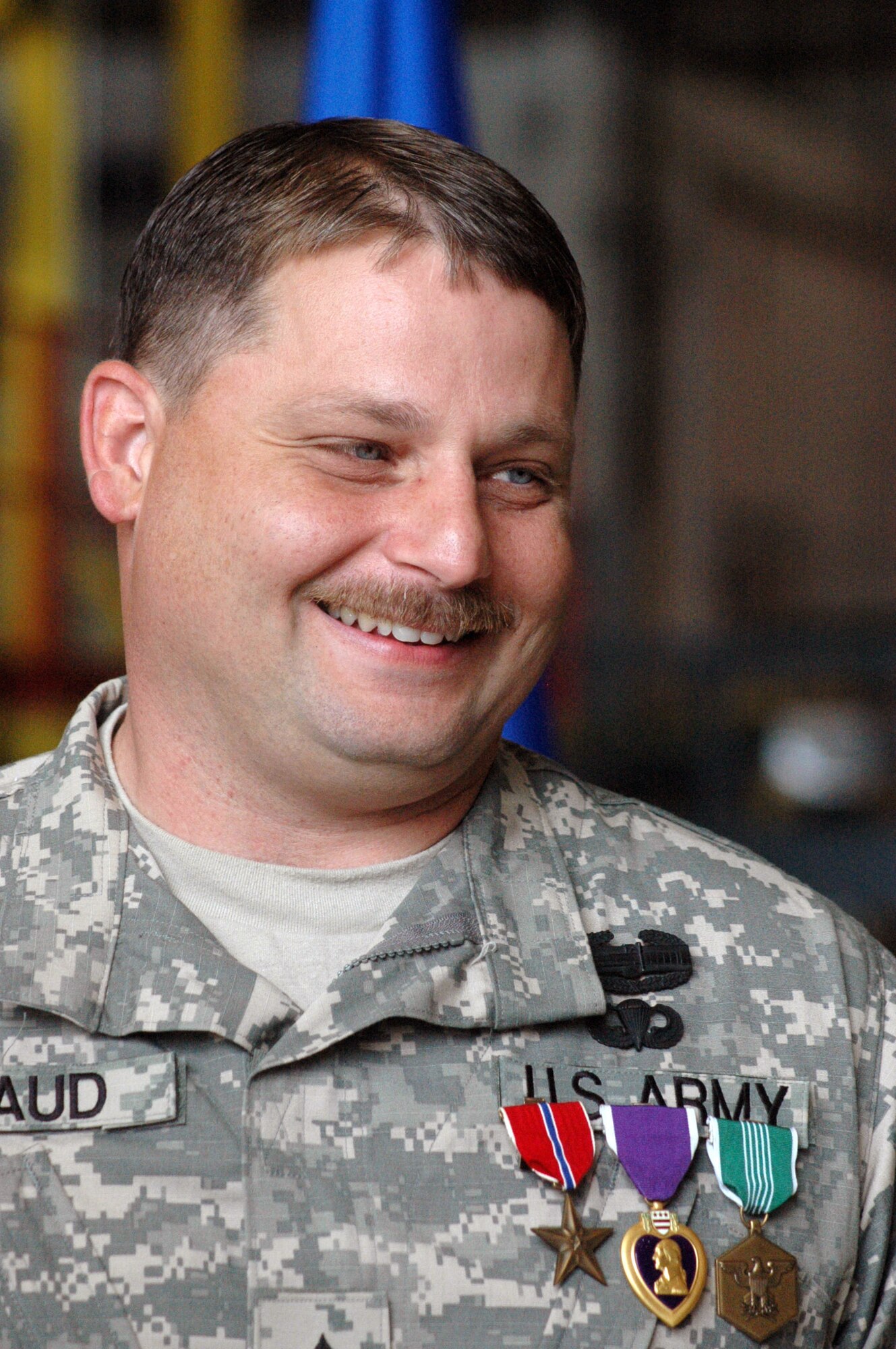 Bryan Braud, an aircraft painter in the 402nd Aircraft Maintenance Group at Robins Air Force Base, Ga., received the Bronze Star, the Purple Heart and the Army Commendation Medal during a ceremony at Robins May 14.  He was a sergeant with the Georgia National Guard and deployed to Iraq when he was wounded in January 2006 while on convoy escort duty.  (U.S. Air Force photo/Sue Sapp)