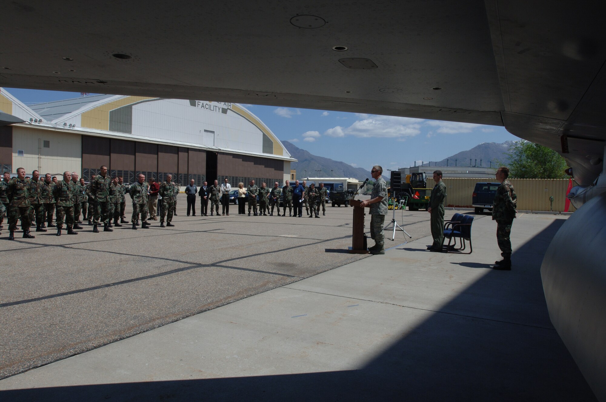 Brig. Gen. Art Cameron, 309th Maintenance Wing commander, addresses the group during the official handing over ceremony of an F-16 that received extensive damage repair from the 309th. The F-16 was handed over to the 388th Fighter Wing May 7. (U.S. Air Force photo by Alex Lloyd)