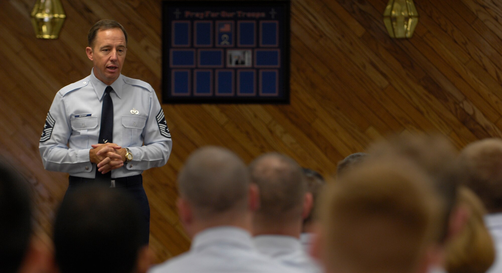 ELMENDORF AIR FORCE BASE, Alaska -- Chief Master Sergeant Anthony Bishop, Pacific Air Forces command chief master sergeant, talks with the Airman Leadership School and Noncommissioned Officer Academy graduates May 16. Chief Bishop was the featured speaker for the PME Center graduation and also toured various facilities on Elmendorf. (U.S. Air Force photo by Airman 1st Class Tinese Treadwell)