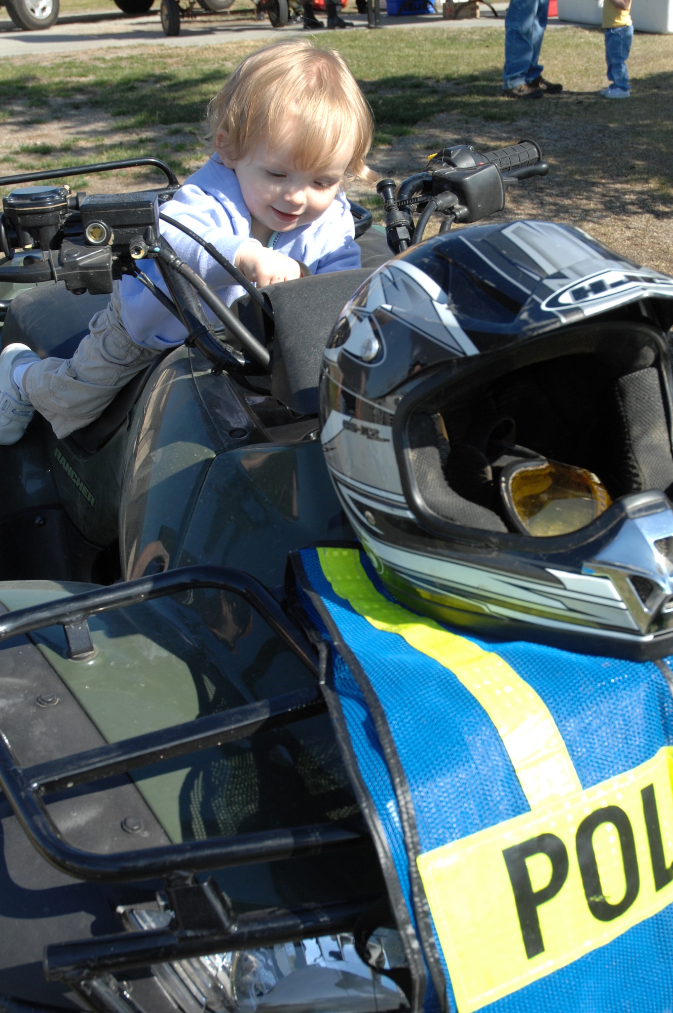 EIELSON AIR FORCE BASE, Alaska -- Payton Schroeder, daughter of Staff Sgt. Jedadiah Schroeder, with the 354th Security Forces Squadron, checks out the components of an all-terrain vehicle used by the 354th SFS during Police Week May 19, here at Eielson AFB, AK. Police Week is an annual event hosted by the 354th SFS in honor of National Police Week. (U.S. Air Force photo by Staff Sgt. Tia Schroeder)
