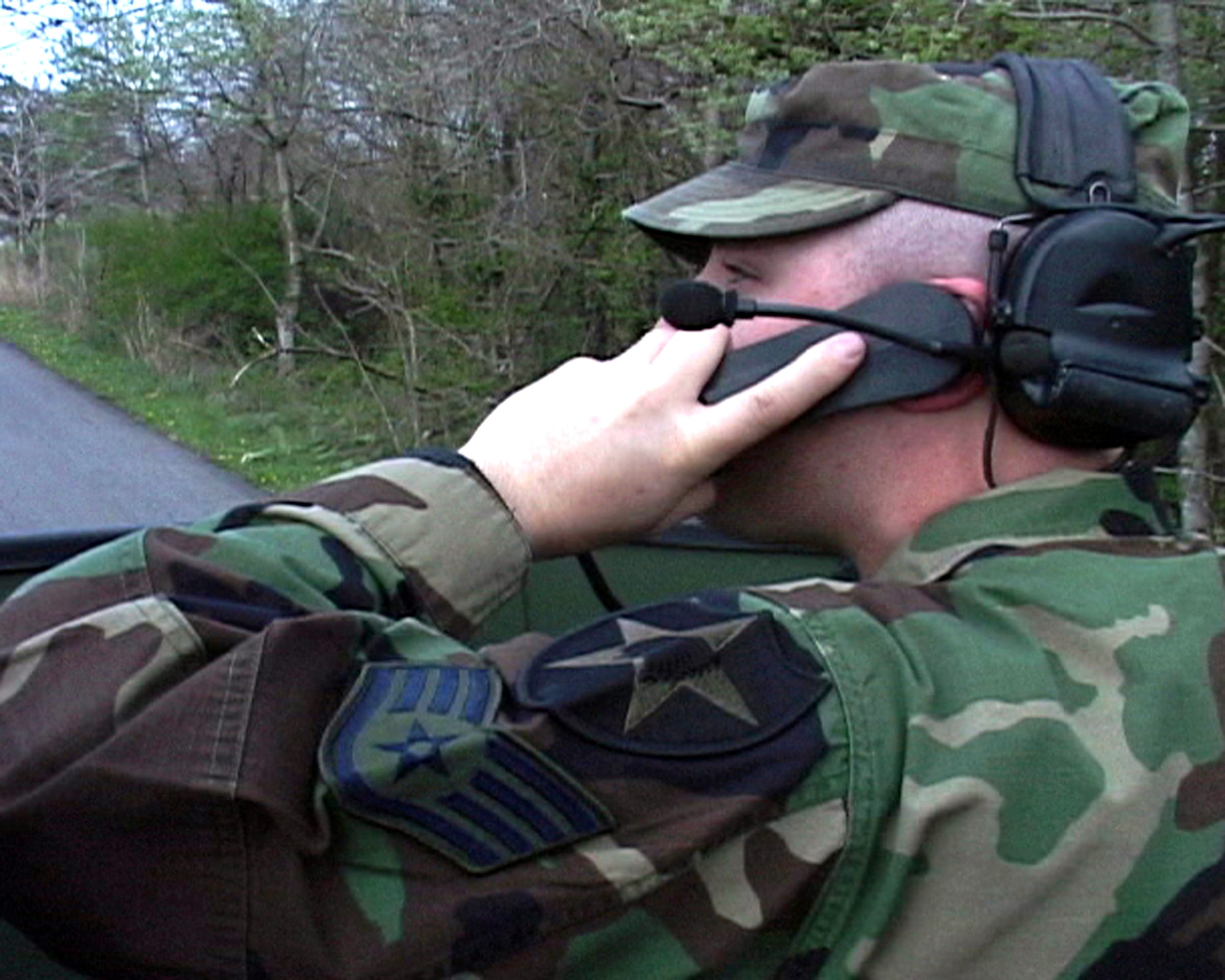 Staff Sgt. Krystoffer Bowman talks an F-16 Fighting Falcon pilot onto a target May 7 at Misawa Air Base, Japan. Sergeant Bowman helps pilots work with joint terminal attack controllers before deploying to fight the war on terrorism. Sergeant Bowman is a joint terminal attack controller. (U.S. Air Force photo/Seaman Shane Arrington) 
