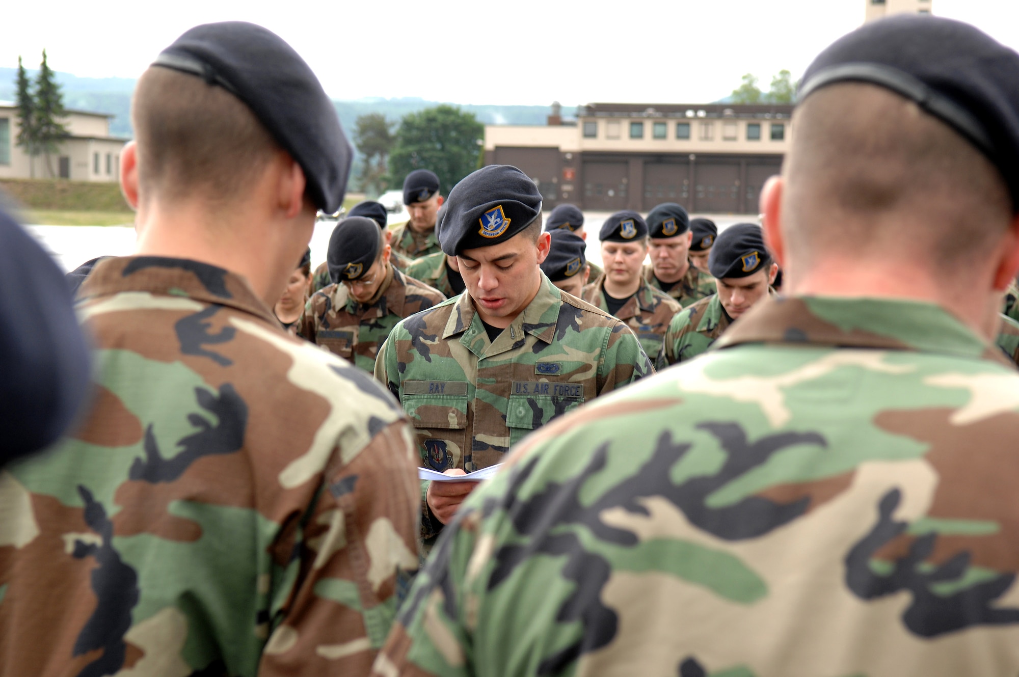 Airman Christopher Ray reads the security forces prayer in respect to fallen Airman during the Last Guard Mount ceremony May 16 at Ramstein Air Base, Germany. The Final Guard Mount Ceremony, which recognizes fallen security forces members, was held in conjunction with National Police Week. Airman Ray is a 435th Security Forces Squadron member. (U.S. Air Force photo/Senior Airman Levi Riendeau)
