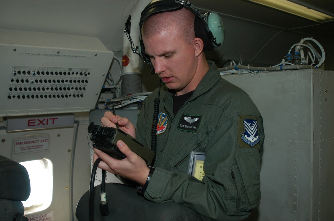 Senior Airman Glenn McIntyre performs troublehooting using a handheld before a flight with the E-8C Joint STARS aircraft while deployed to Savannah, Ga. (Photo by Tech. Sgt. Tim Neville)                               