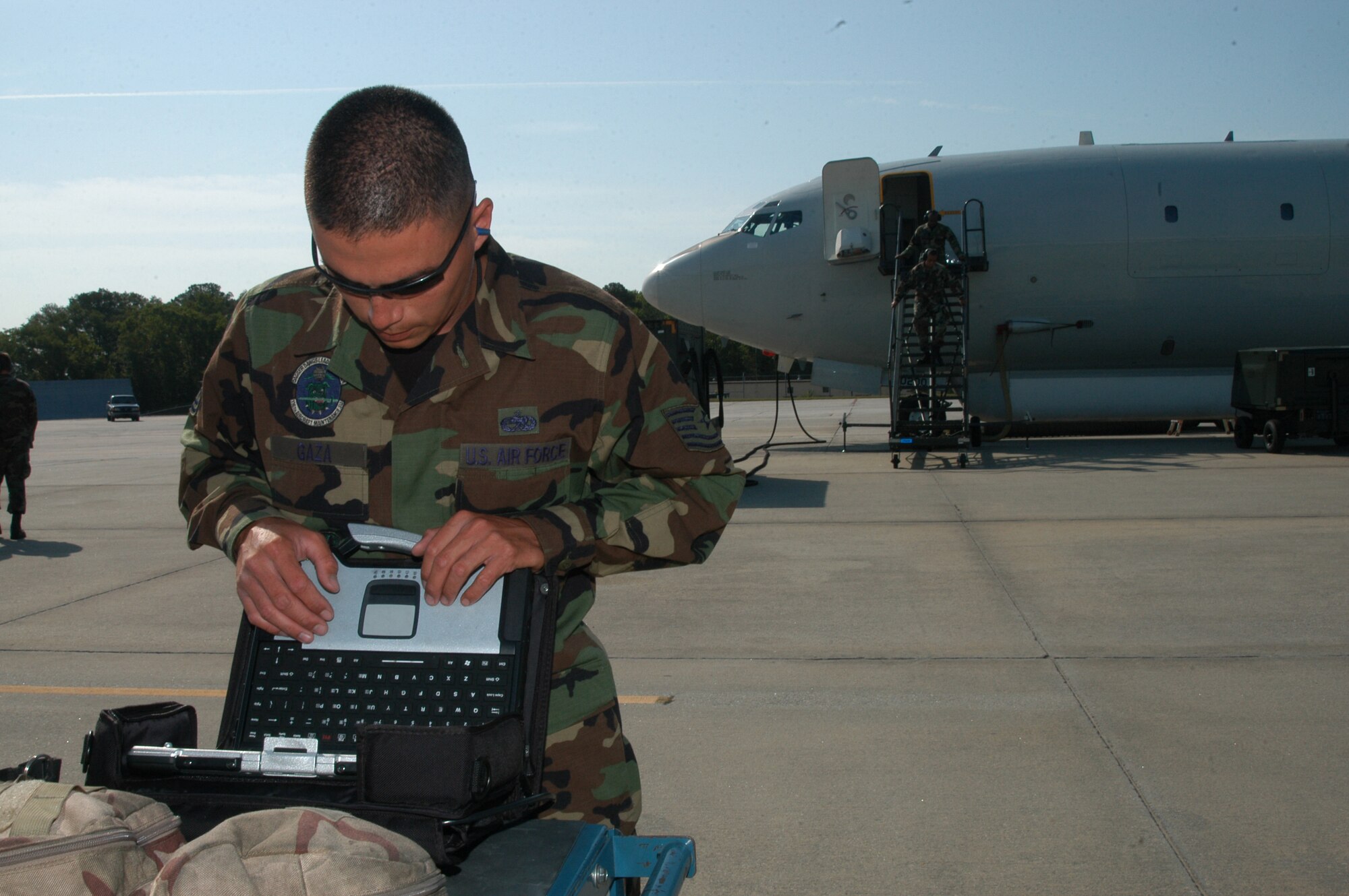 Tech. Sgt. Jeremy Gaza, 116th Aircraft Maintenance Squadron, performs troubleshooting on the portable computer while preparing the E-8C Joint STARS aircraft for a launch while deployed to Savannah, Ga. (Photo by Tech. Sgt. Tim Neville)