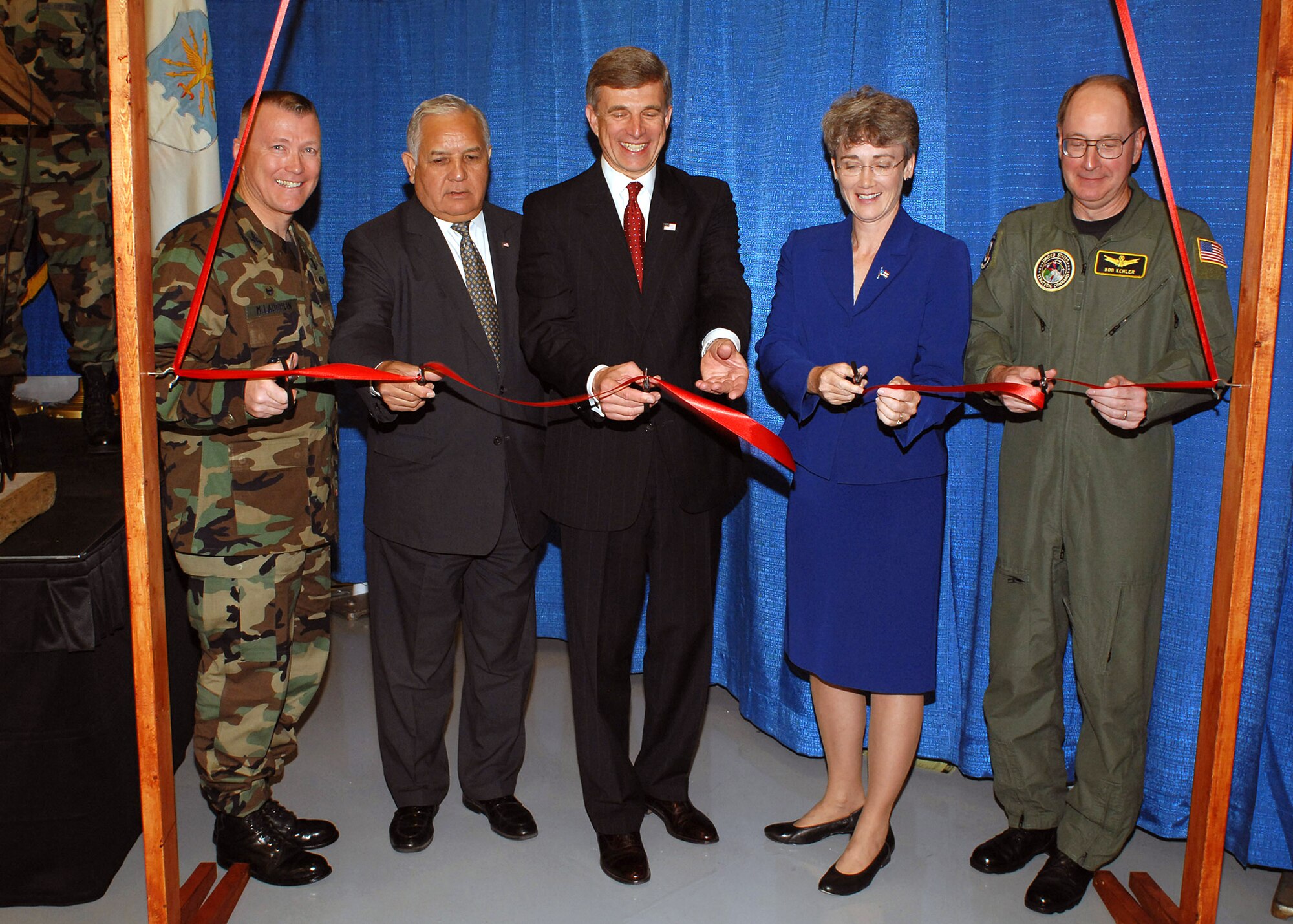 Col. Kevin McLaughlin (left to right), Rep. Silvestre Reyes, Dr. Ronald M. Sega, Rep. Heather Wilson, and Lt. Gen. C. Robert Kehler cut the ribbon for the new joint Operationally Responsive Space Center May 21 at Kirtland Air Force Base, N.M. Colonel McLaughlin is the ORS Office director, Dr. Sega is the Department of Defense's executive agent for space and under secretary of the Air Force, and General Kehler is the U.S. Strategic Command deputy commander. (U.S. Air Force photo/Todd Berenger)