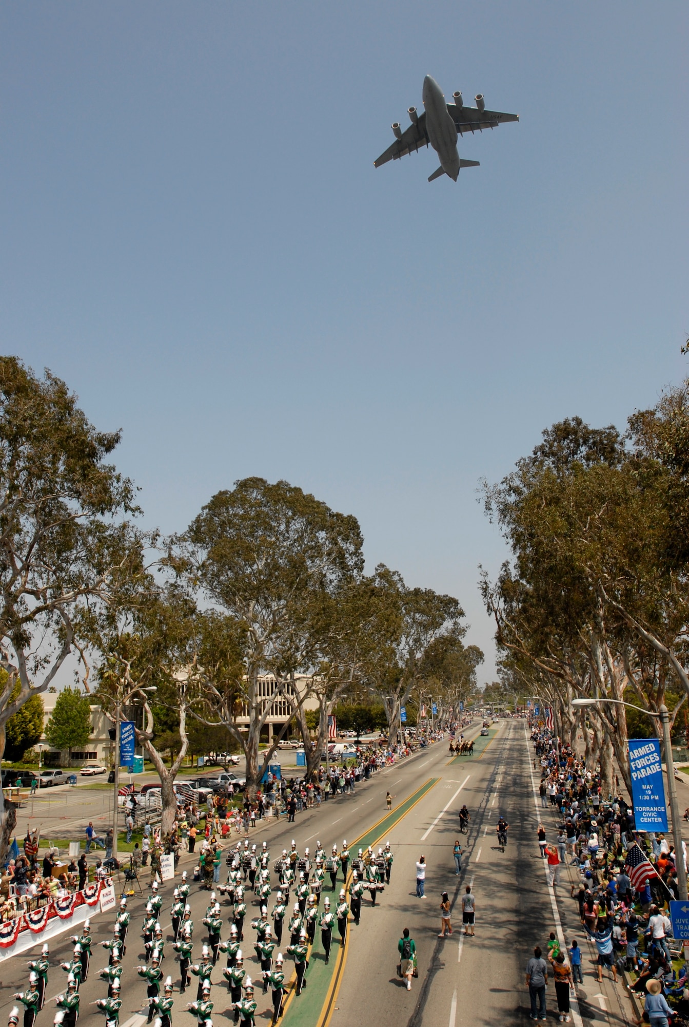 An Air Force C-17 flys over the parade route during the 2007 Torrance Armed Forces Day Parade, May 19. Gen. Kevin Chilton, Air Force Space Command commander, served as the Grand Marshal for the parade. A Los Angeles AFB honor guard led the way as Los Angeles, Edwards, and Vandenberg Air Force Bases and March Air Reserve Base marched passed the crowds with a total of more than 300 airmen participating. 
