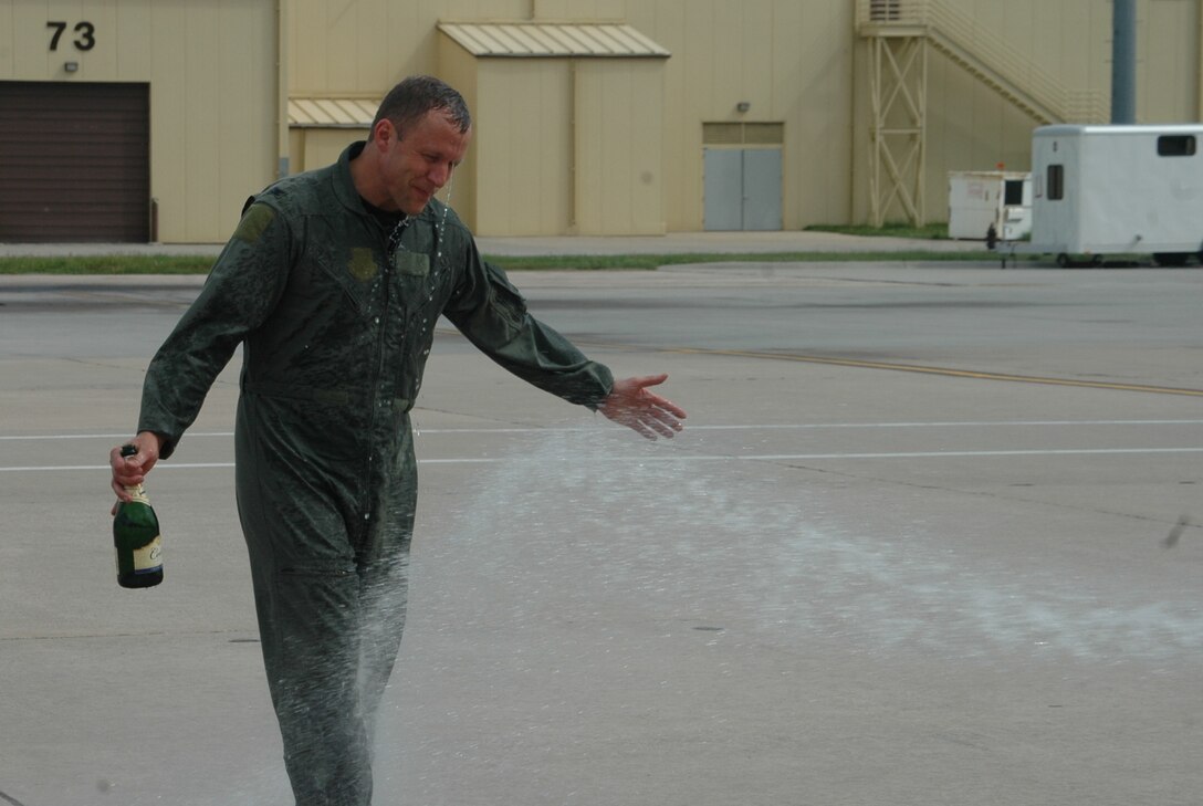 Col. Bruce Emig, 28th Bomb Wing vice commander, celebrates the completion of his final B-1 flight, also known as "Fini-flight", May 11 here. Col. Emig will take over command of the 5th Bomb Wing, Minot Air Force Base, N.D. during a June 5 change of command ceremony . 